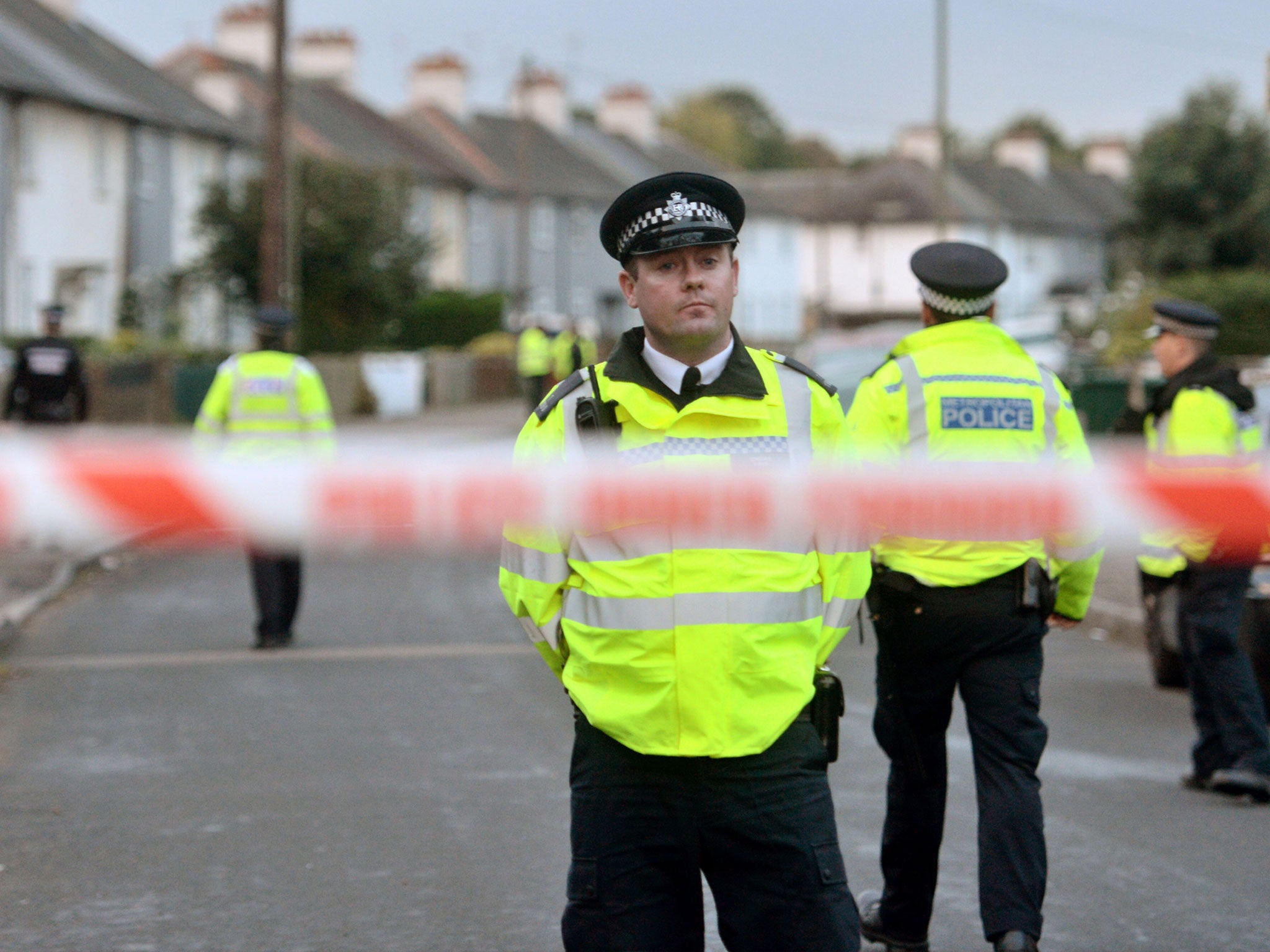 Police officers closed off a street in the Sunbury-on-Thames area, where Ahmed Hassan lived