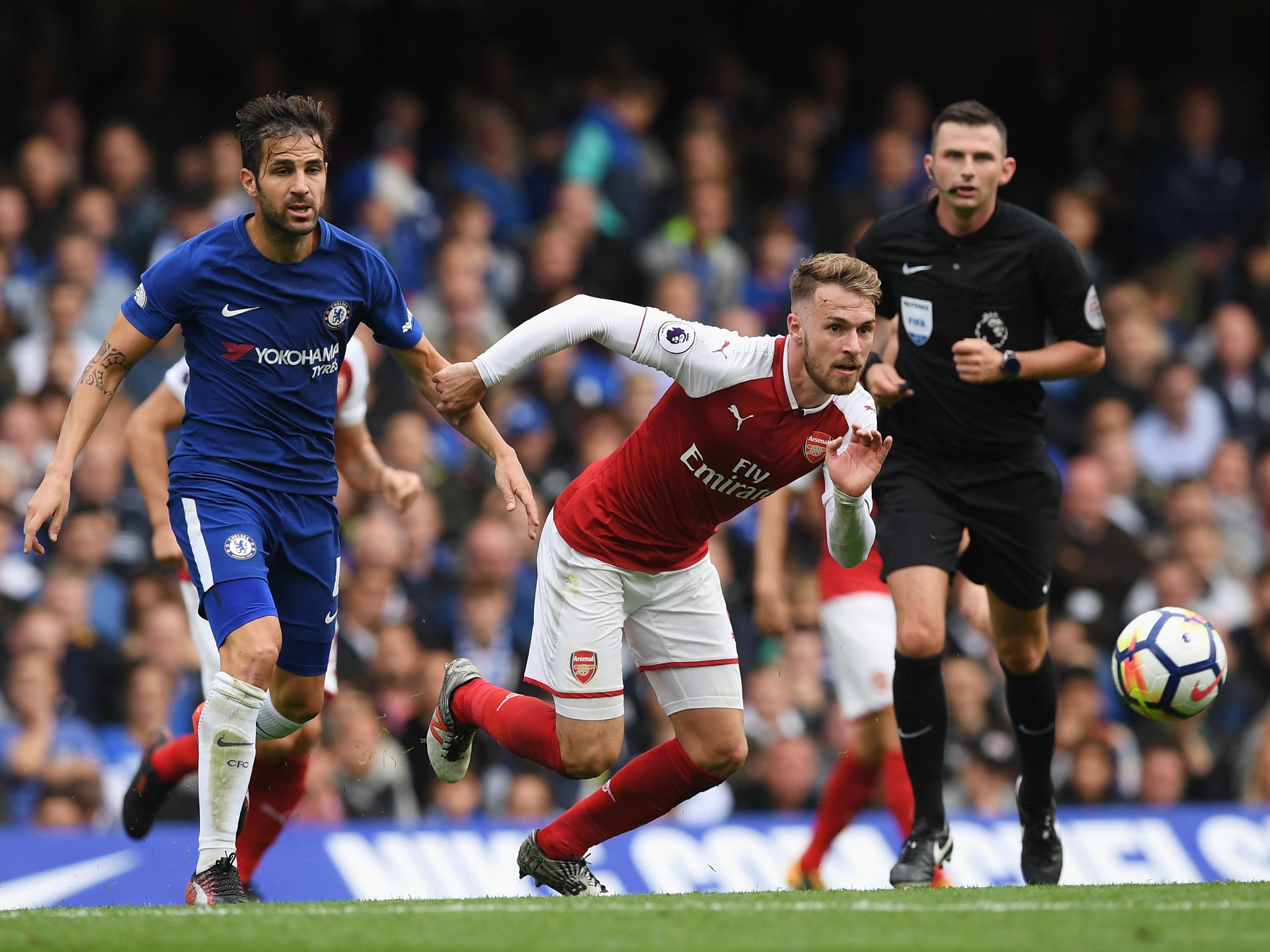 Aaron Ramsey and Cesc Fabregas in action at Stamford Bridge