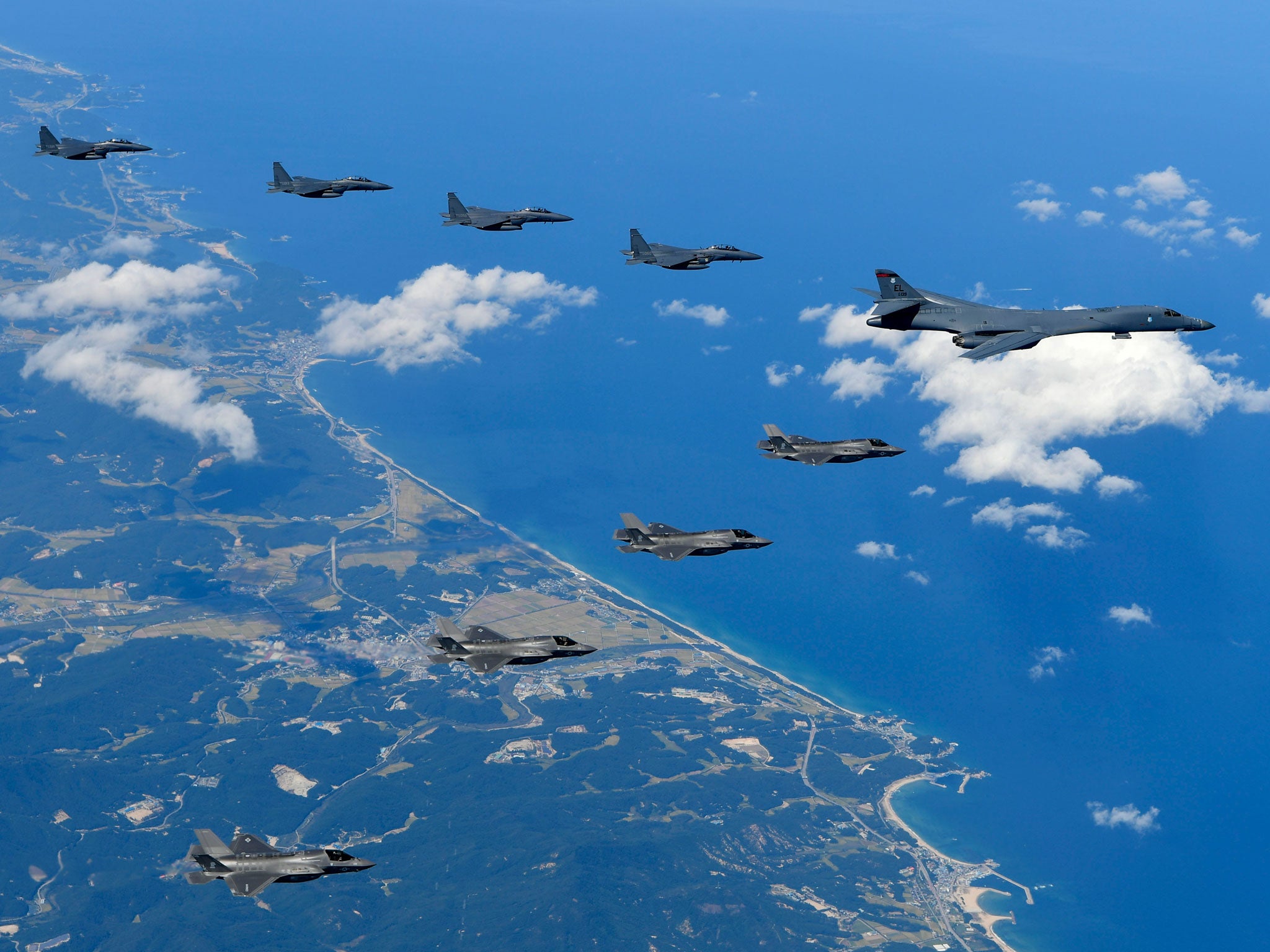 US B-1B bombers, F-35B stealth fighter jets and South Korean F-15K fighter jets fly over the Korean Peninsula during a joint drills; China and Russia are holding their own joint naval exercise in the region