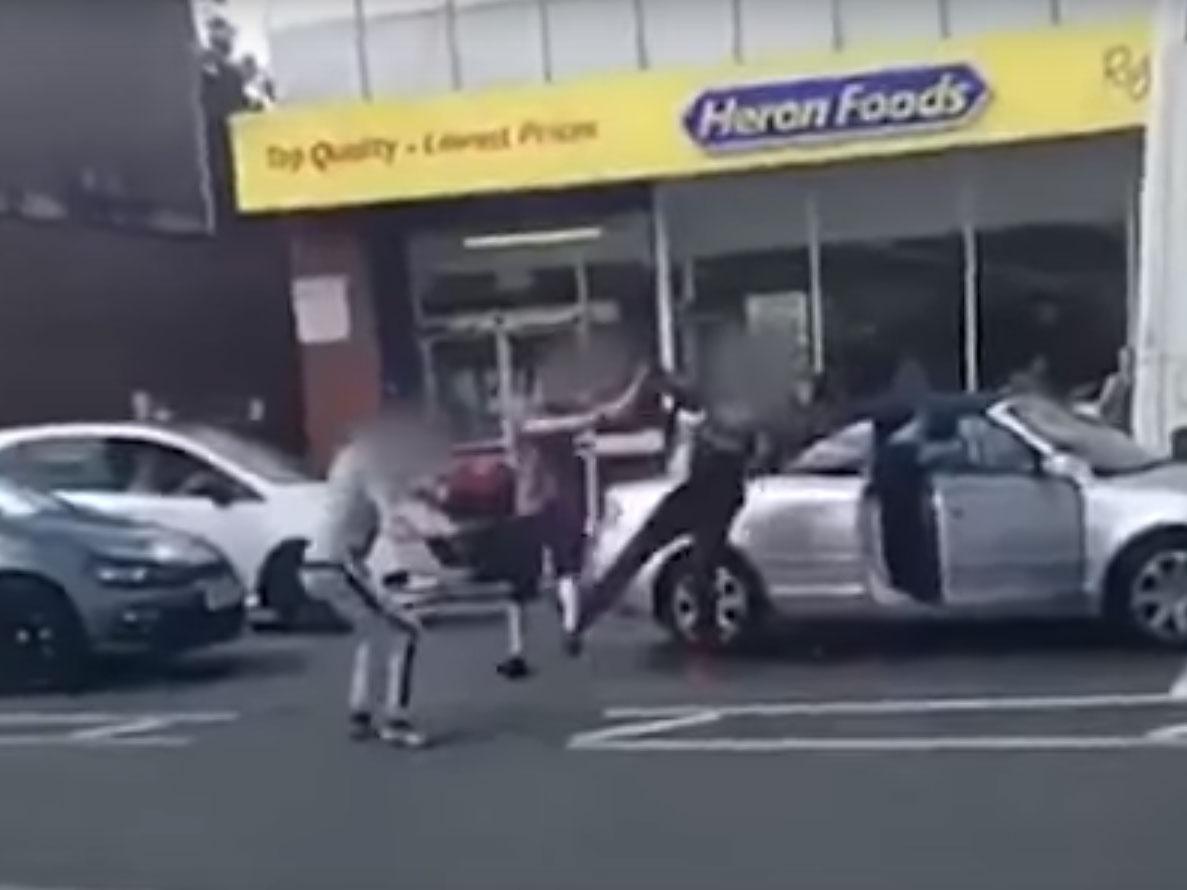 The man wearing red is seen knocked to the floor twice in the footage