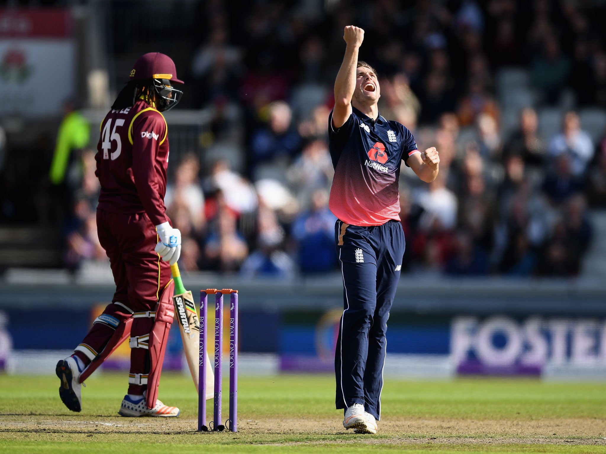 Chris Woakes celebrates dismissing Chris Gayle