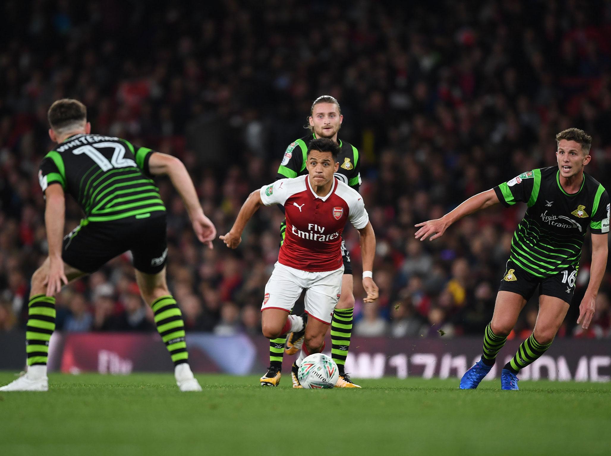 &#13;
Sanchez played as Arsenal scraped past Doncaster &#13;