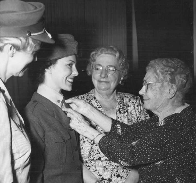 Opha May Johnson (center right) was the first woman to join the Marines in 1918.