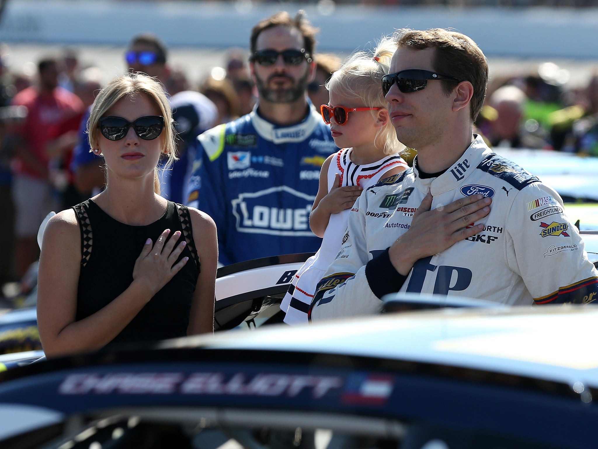 Brad Keselowski honours the American national anthem ahead of the Nascar race at New Hamshire Motorspeedway