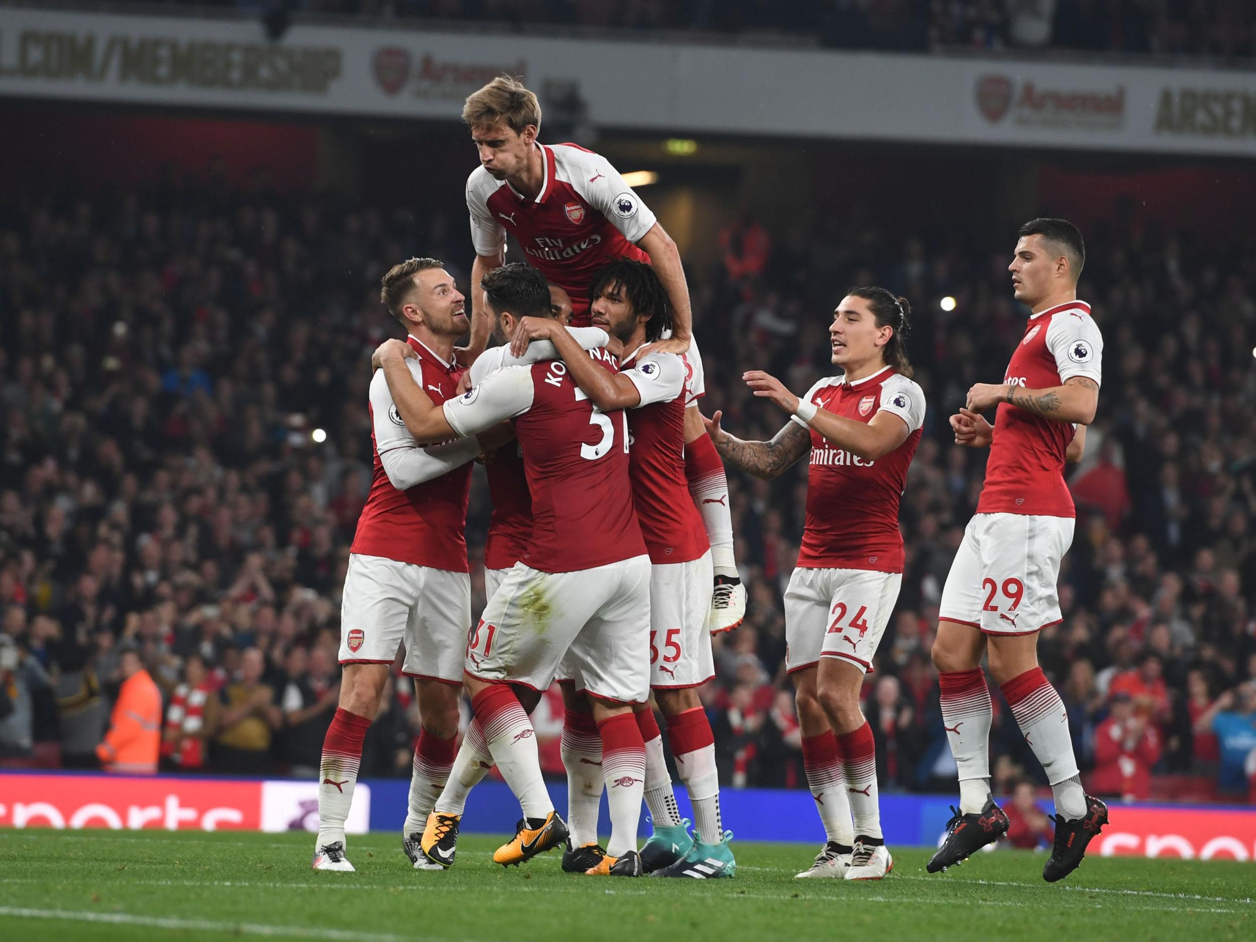 Arsenal's players celebrate with Alexandre Lacazette after his second goal