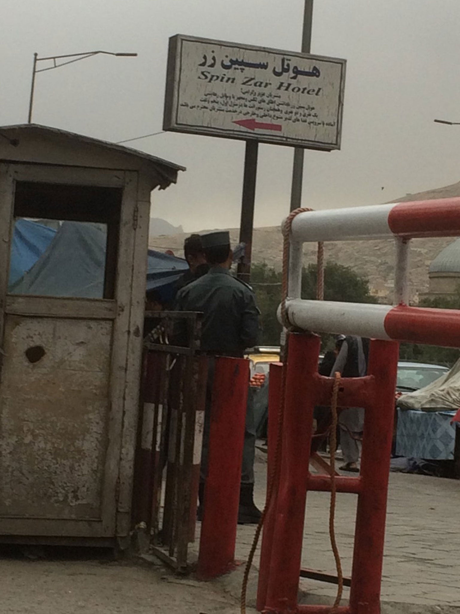 Guards outside Samim Bigzad’s hotel in Kabul