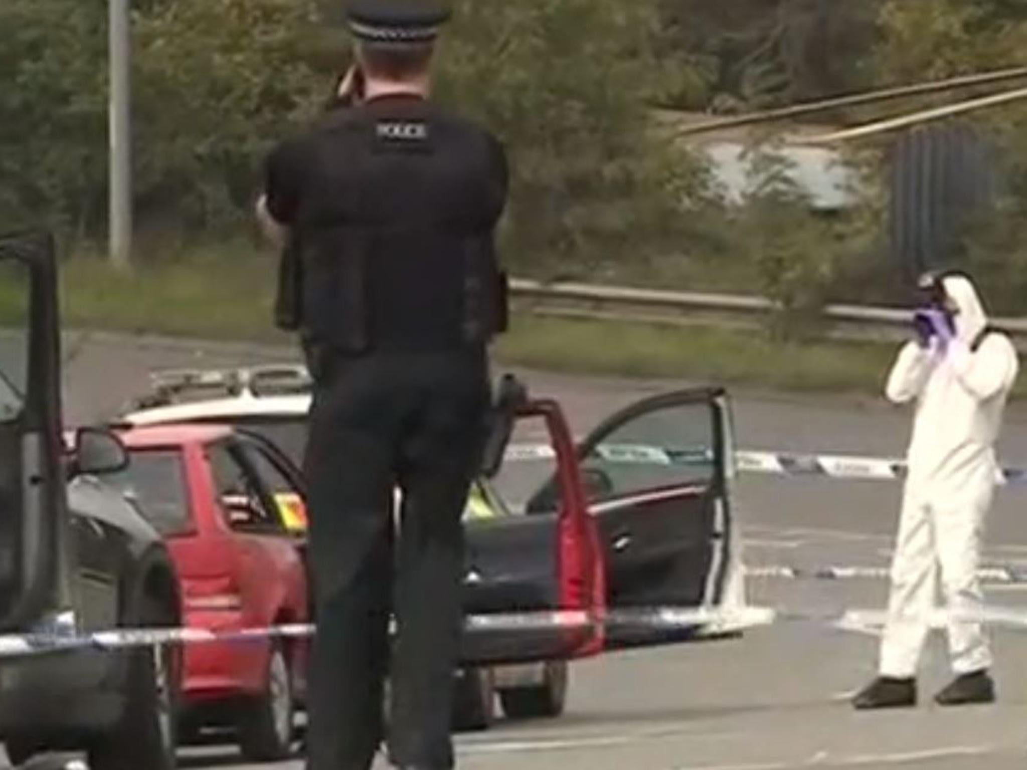 Police photograph a red hatchback on the A369 near Portishead