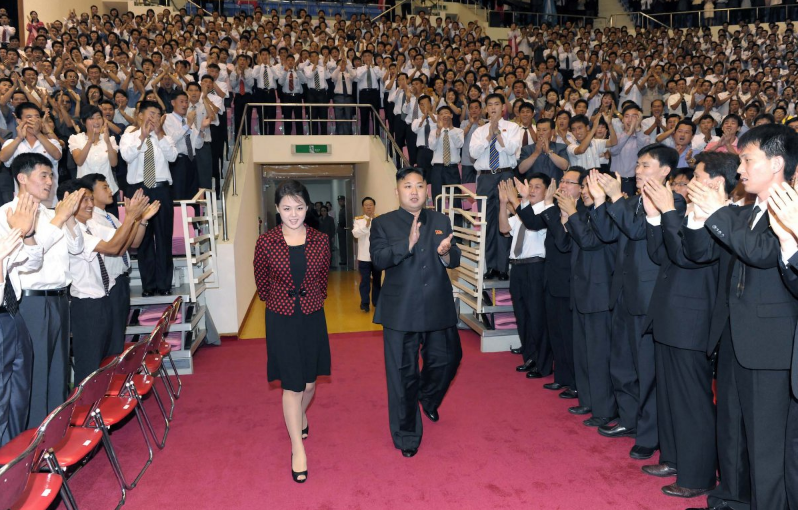 Mr Kim and Ms Ri arrive at an auditorium to attend a celebration of the 59th anniversary of ‘the victory’ of 1950-53 Korean War on 31 July, 2012 (Reuters)