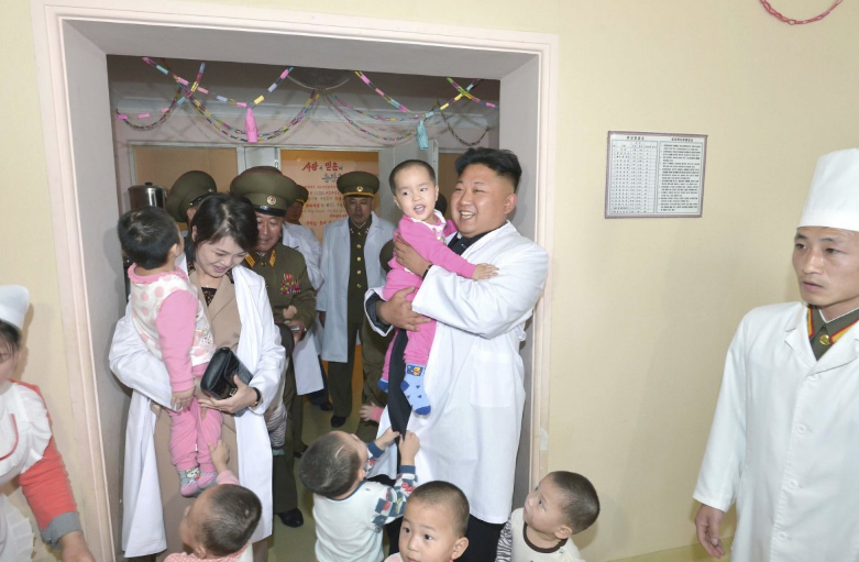 The couple play with children during a visit to the Taesongsan General Hospital in Pyongyang (Reuters)