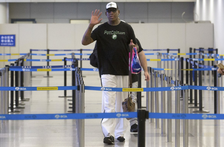 Dennis Rodman prepares to go through immigration at Beijing Capital International Airport in Beijing in June 2017 (AP)