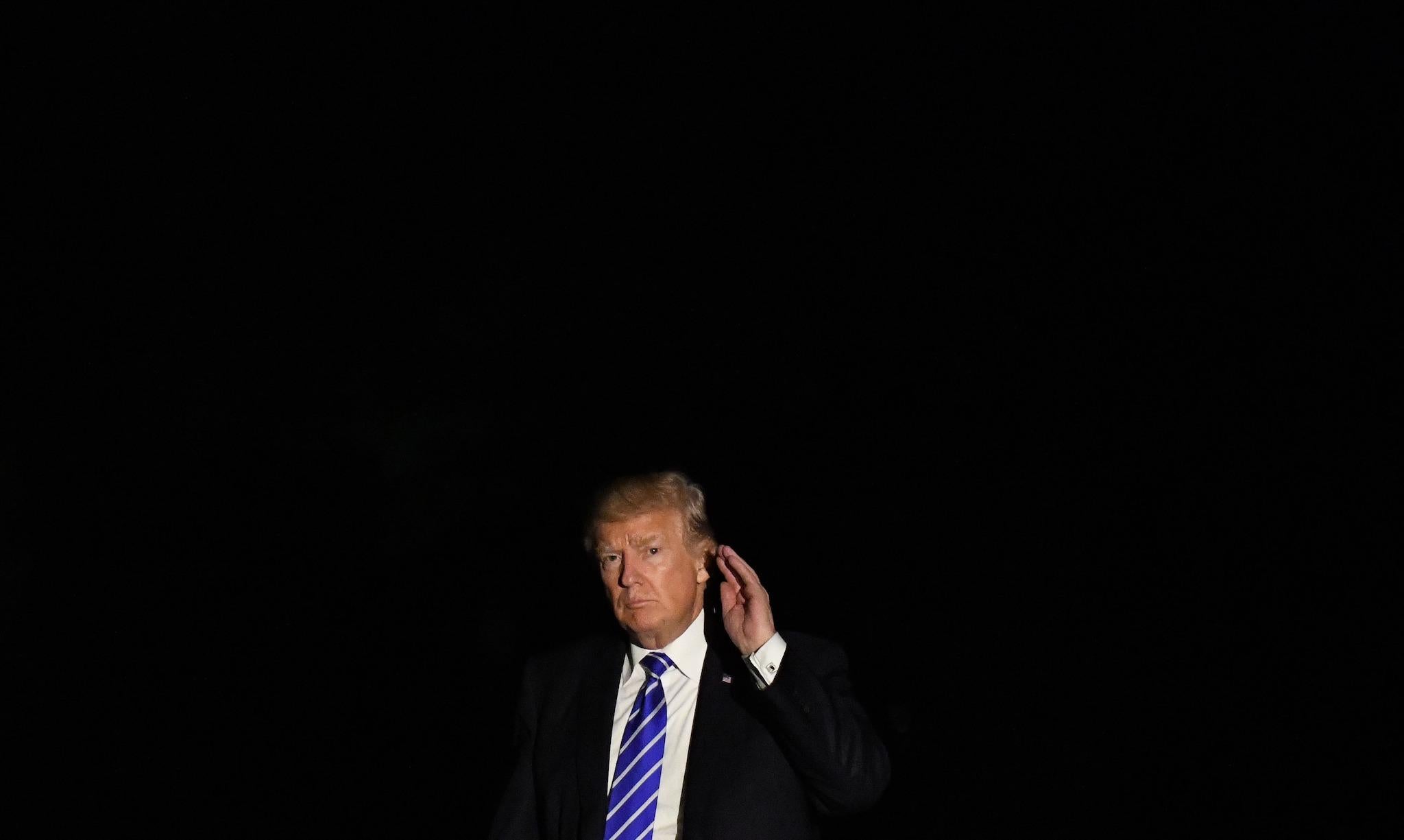 U.S. President Donald Trump walks on the South Lawn after he returns to the White House on September 26, 2017 in Washington, DC