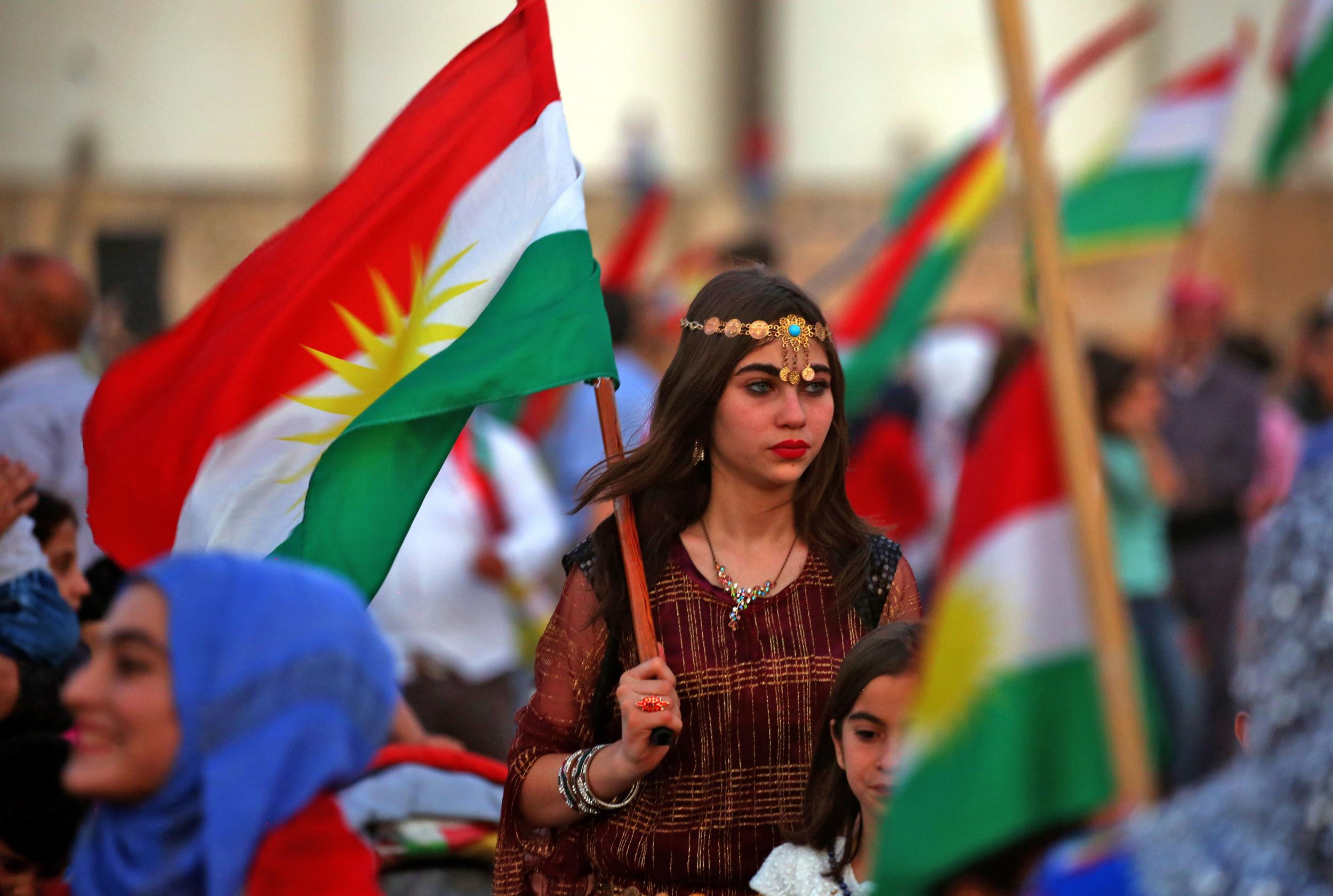 Kurds in the northeastern Syrian city of Qamishli turn out on September 26, 2017 to support the independence referendum in Iraq's autonomous northern Kurdish region