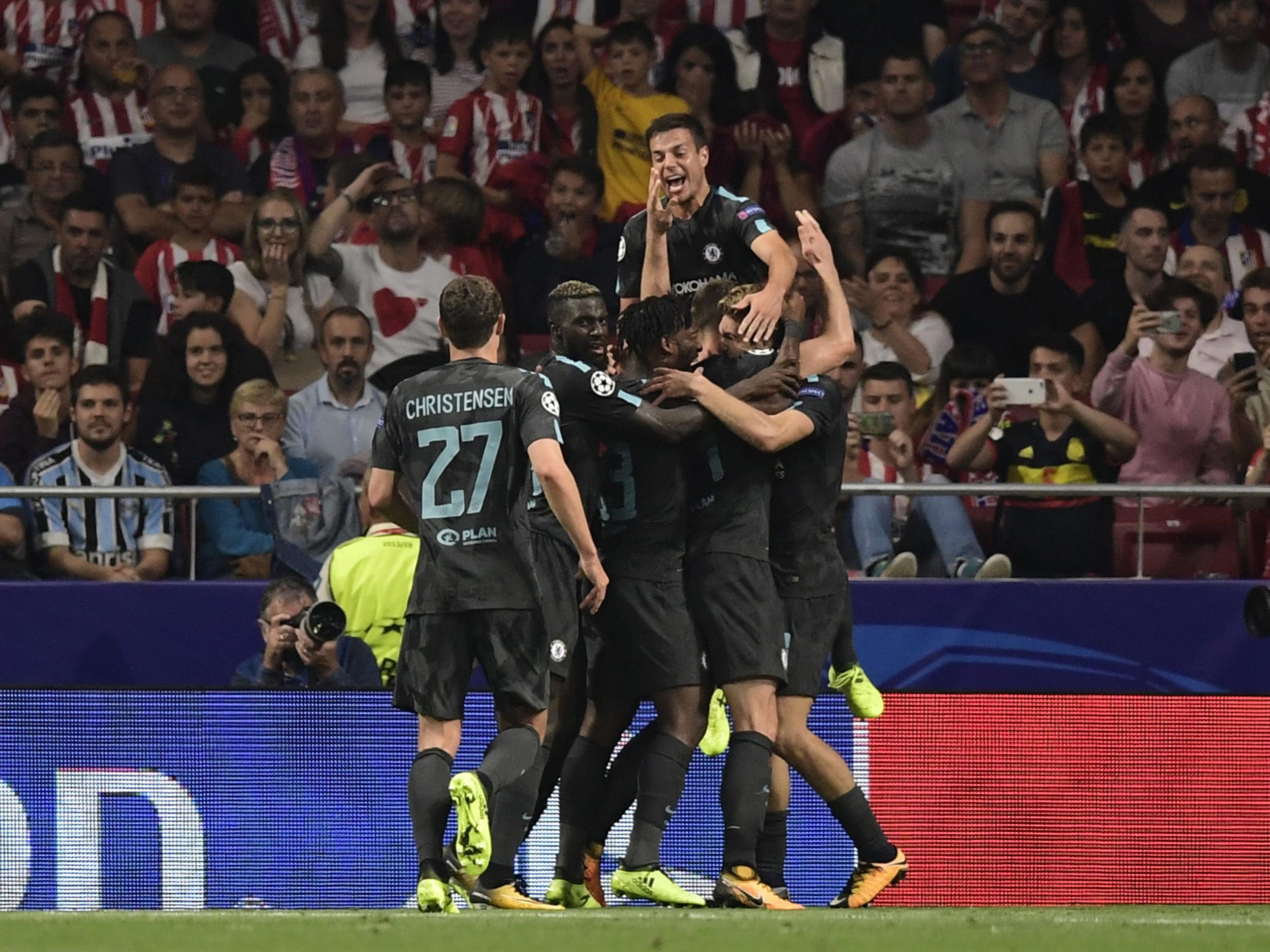 Michy Batshuayi is mobbed by his teammates after scoring Chelsea's dramatic winner