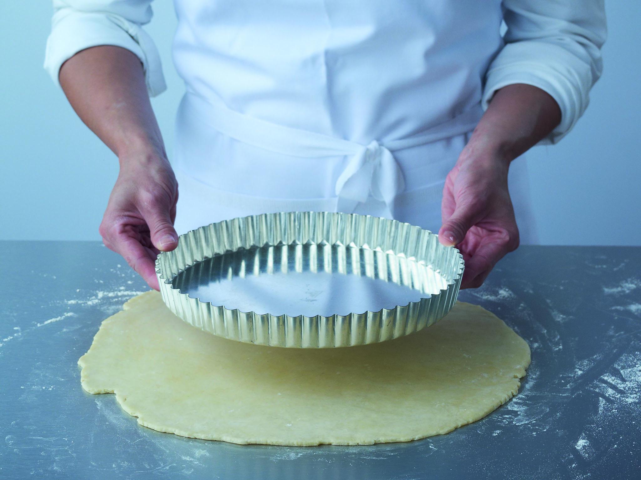 1. Roll the pastry to a circle large enough to line the bottom and sides of the flan tin or ring. You can work out the diameter of pastry needed by measuring the tin or ring from side to side with a piece of string and checking this against the rolled out pastry. However, with practice it is easy to measure by eye