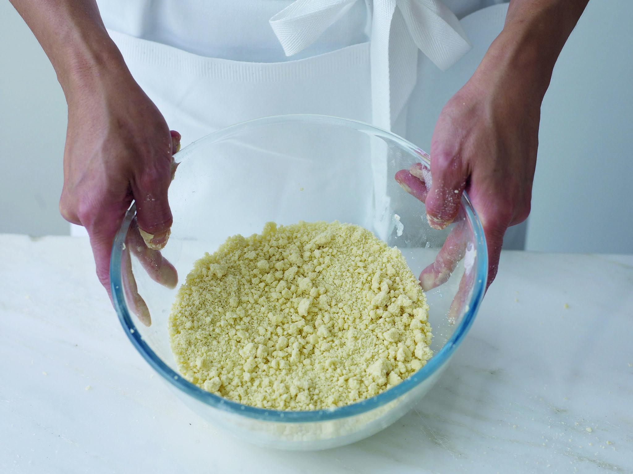 4. Give the bowl an occasional shake to lift larger lumps of butter to the surface. The mixture should become a uniform fine, pale, crumb with no visible lumpsr. If the mixture begins to turn yellow, the butter is softening too quickly and you need to put the bowl in the fridge for 5-10 minutes to chill the butter