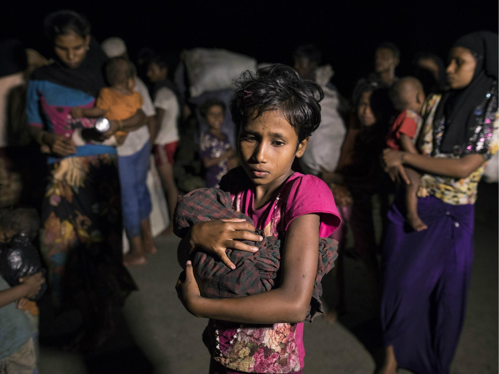 Hundreds of Rohingya arrive by boats in the safety of darkness on Shah Porir Dwip island, Cox's Bazar, Bangladesh (Paula Bronstein/Getty)