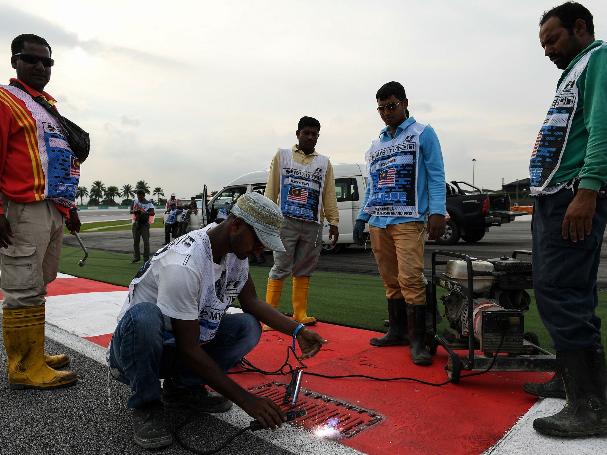 Romain Grosjean crashed his Haas after striking a loose drain cover in Turn 13