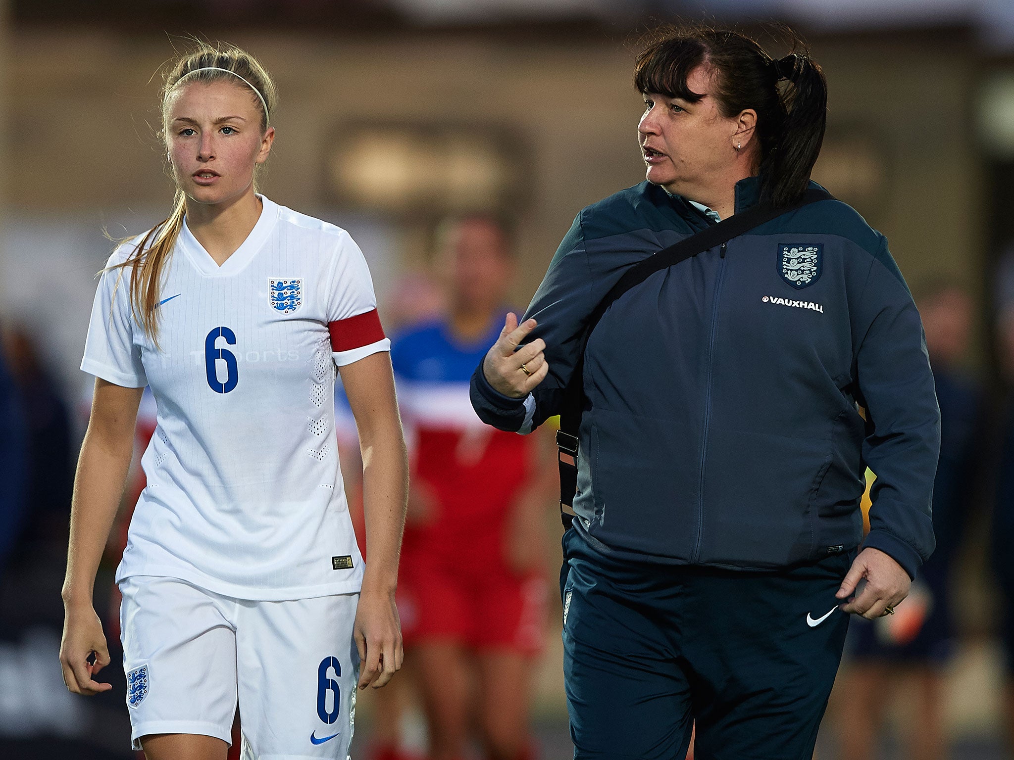 Marley with England U19s player Leah Williamson during an international friendly against the USA in 2016