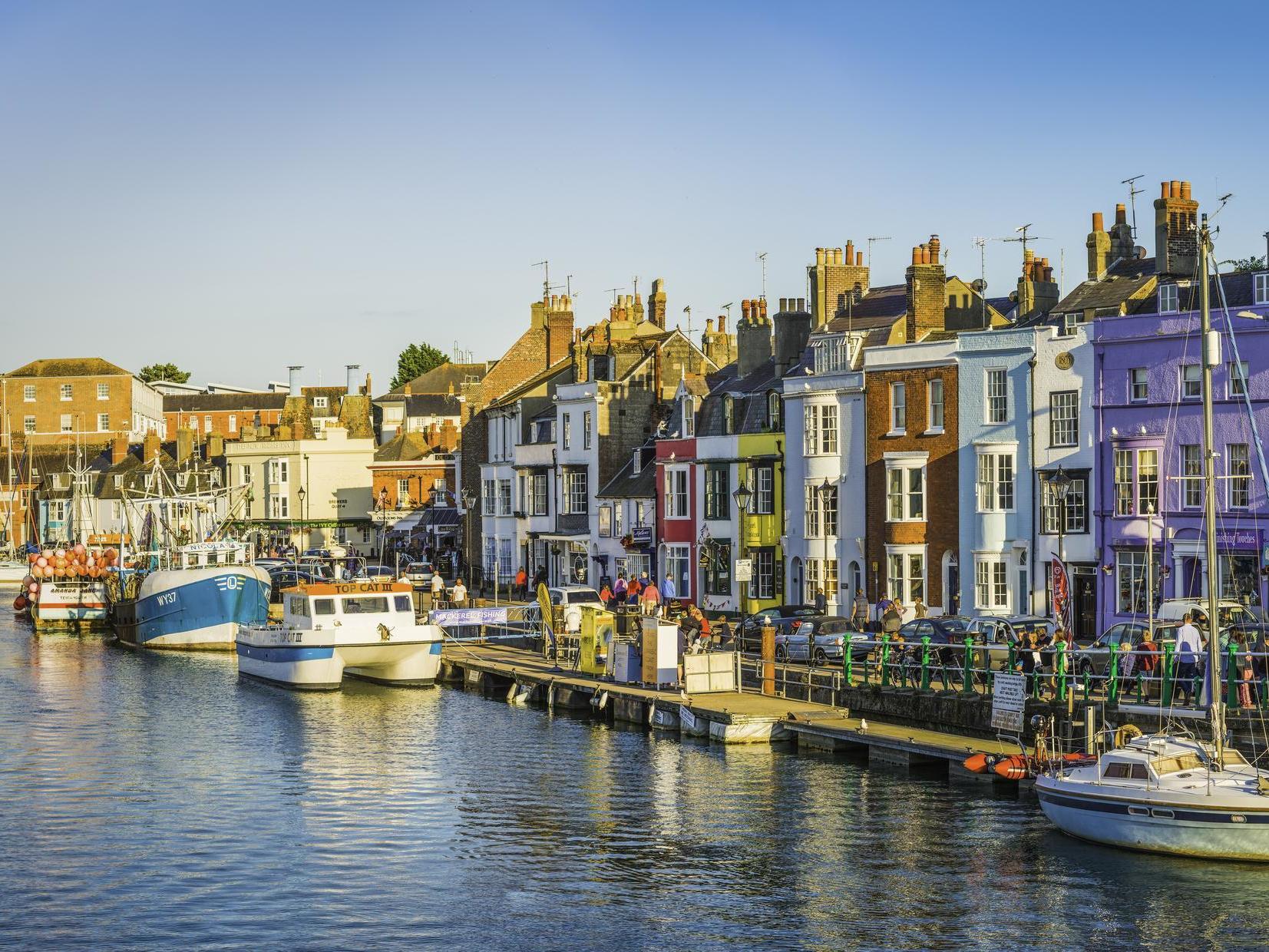 The man was found dead at a home on the seafront of Weymouth, Dorset.