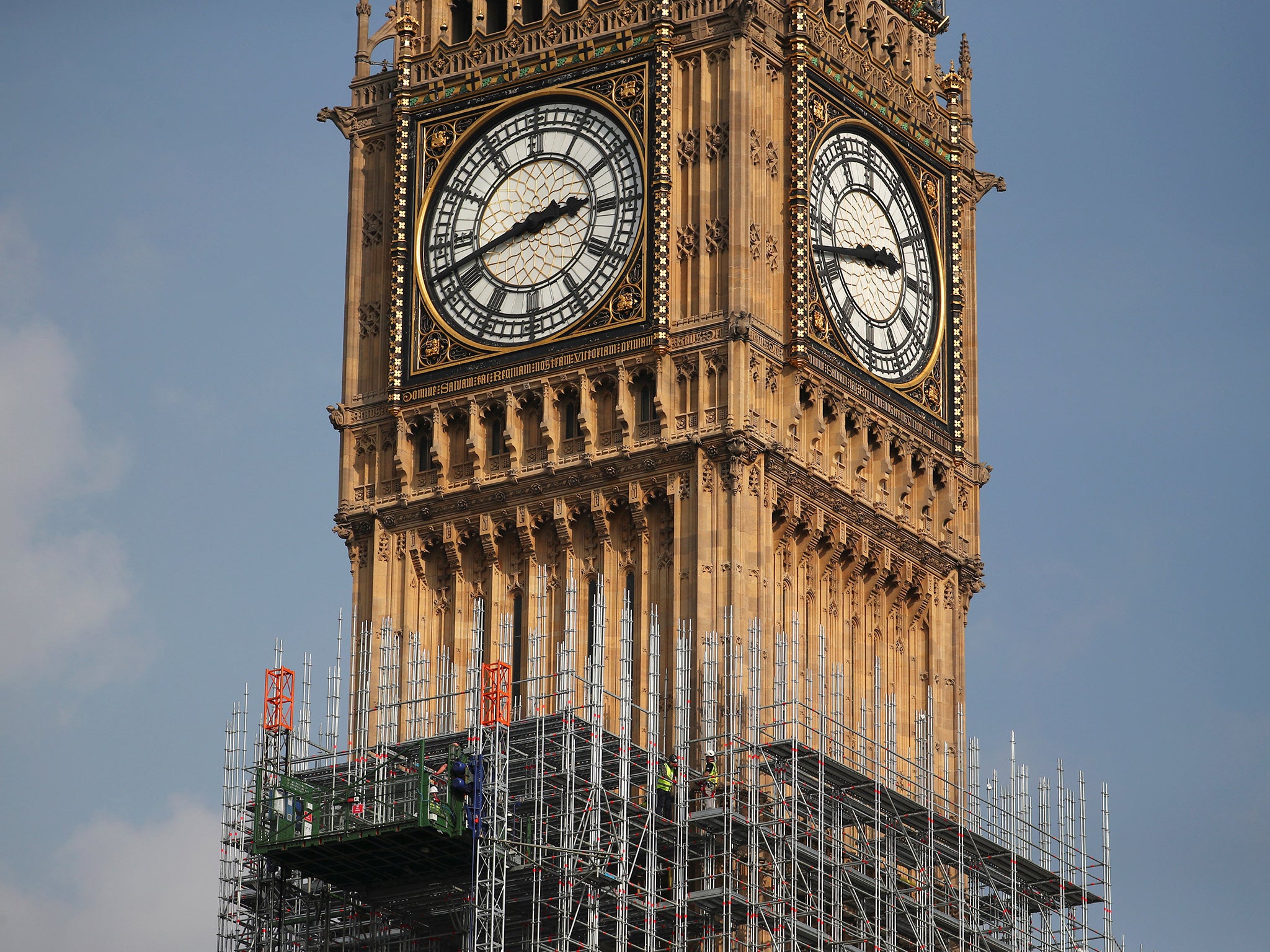 Scaffolders work on the Elizabeth Tower, home of the bell known as Big Ben