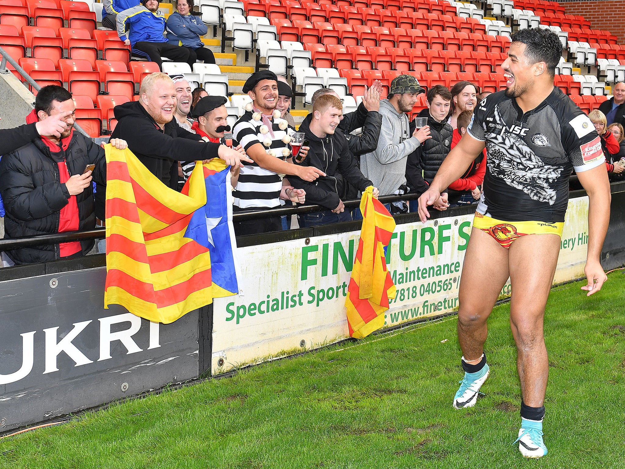 Fouad Yaha celebrates Catalans' victory with the fans