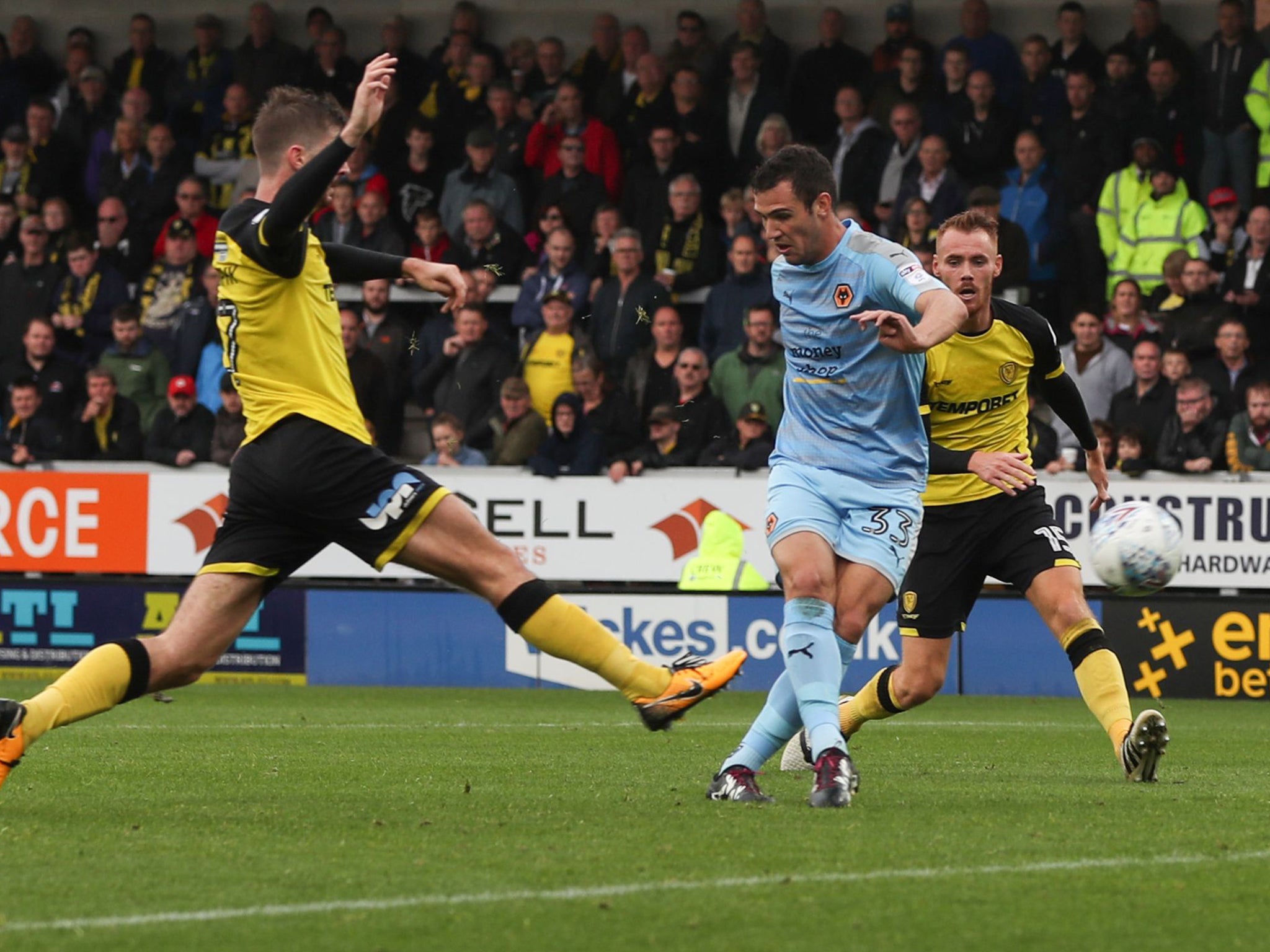 Leo Bonatini of Wolverhampton Wanderers scores the fourth goal to complete the rout of Burton Albion