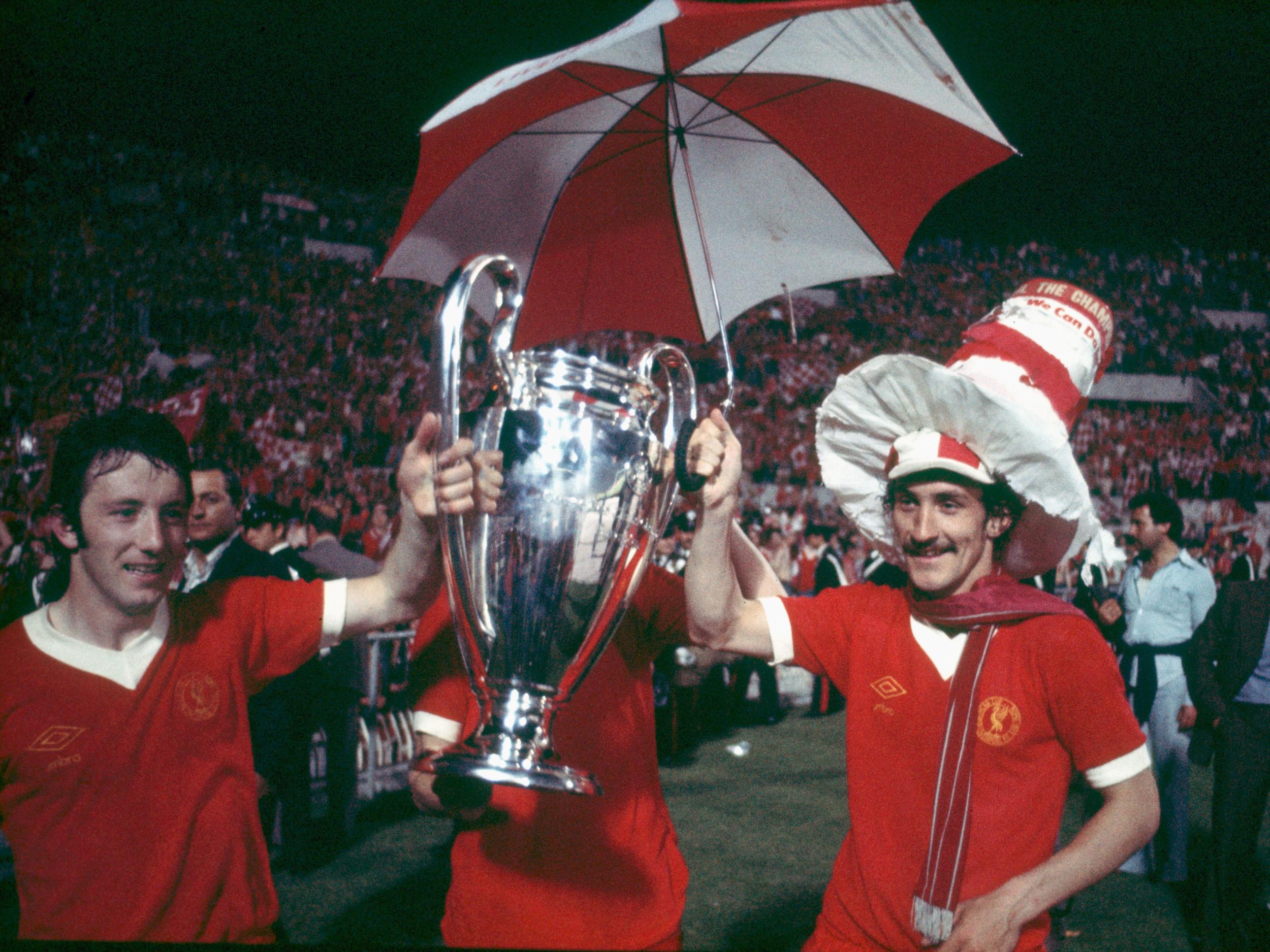 Terry McDermott (r) lifts the European Cup with Liverpool