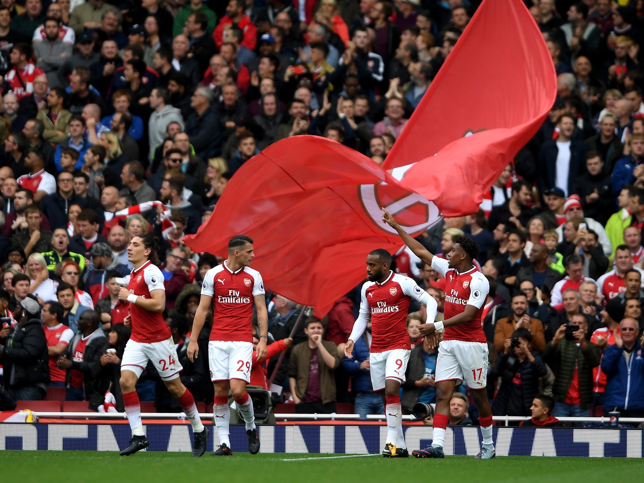 Arsenal celebrate Alex Iwobi's goal that secured a 2-0 win over Brighton