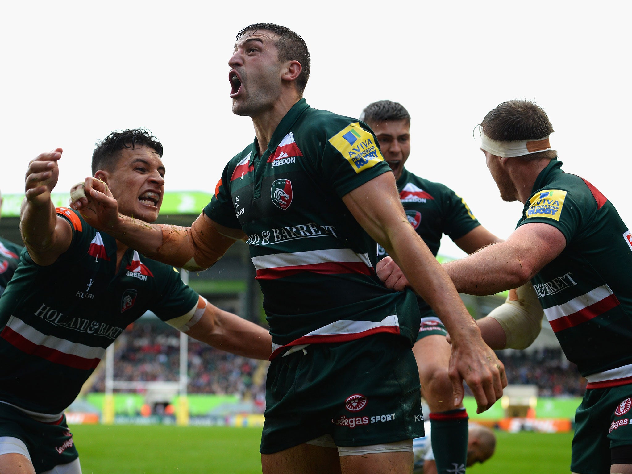 May celebrates his winning try with his Tigers teammates