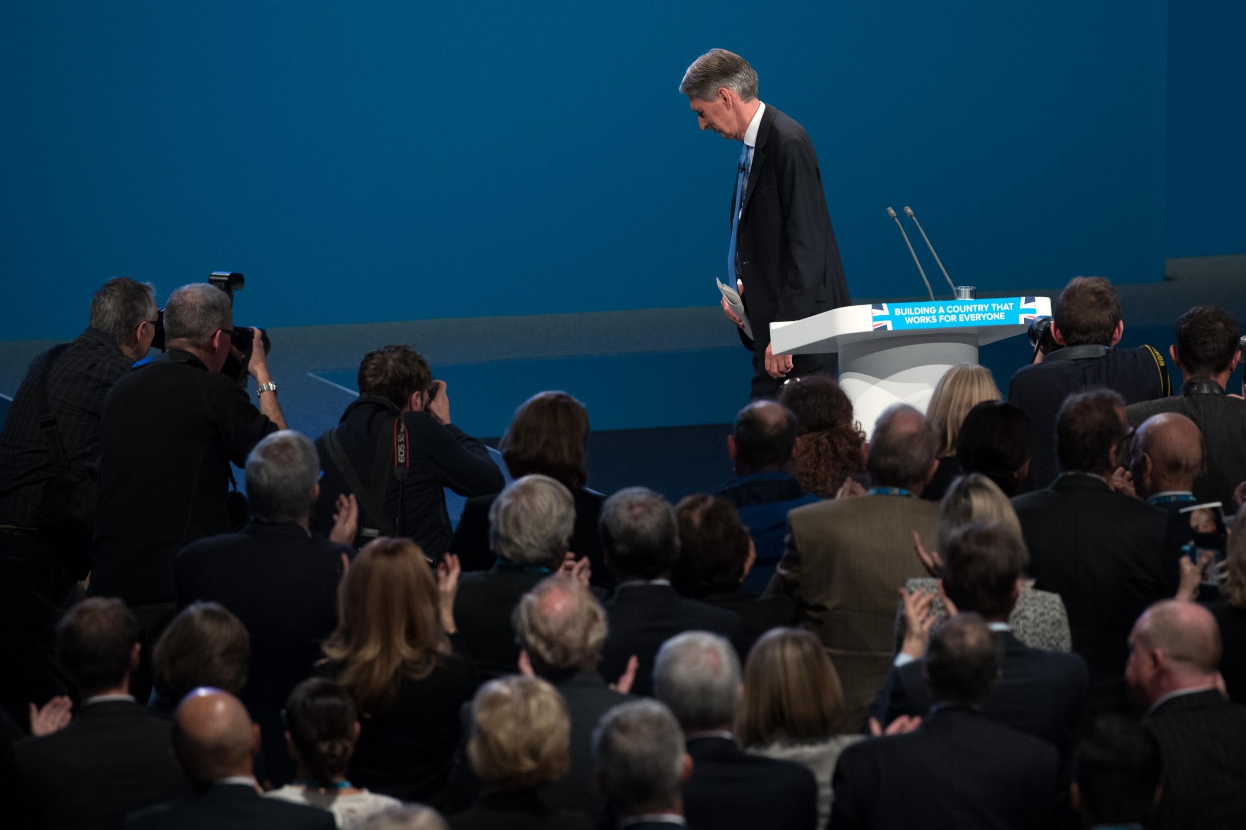 The applause lasted barely long enough for the Chancellor to leave the stage