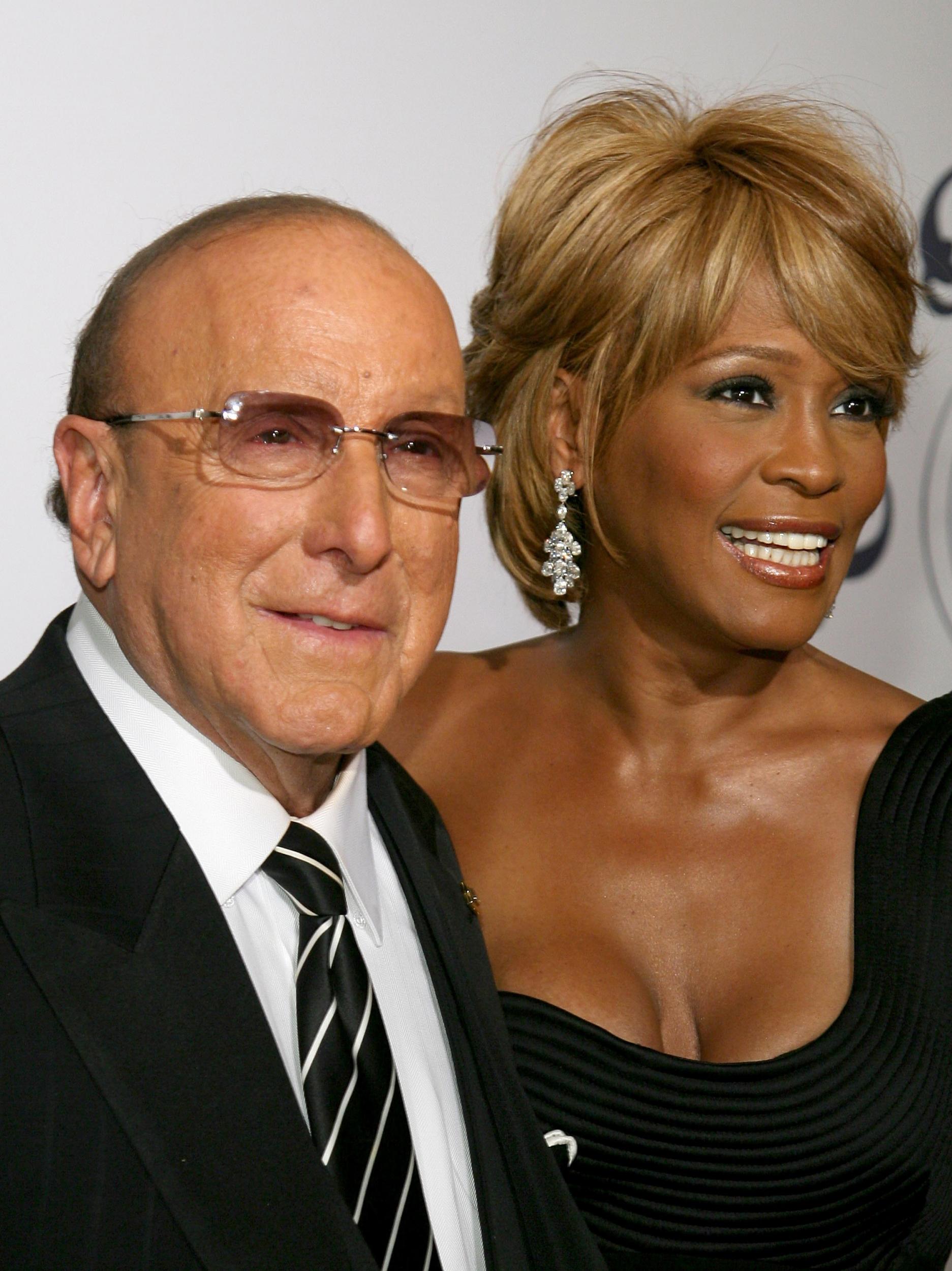 Producer Clive Davis and singer Whitney Houston arrive at the 17th Annual Mercedes-Benz Carousel of Hope Ball at the Beverly Hilton Hotel in October 2006 (Getty)