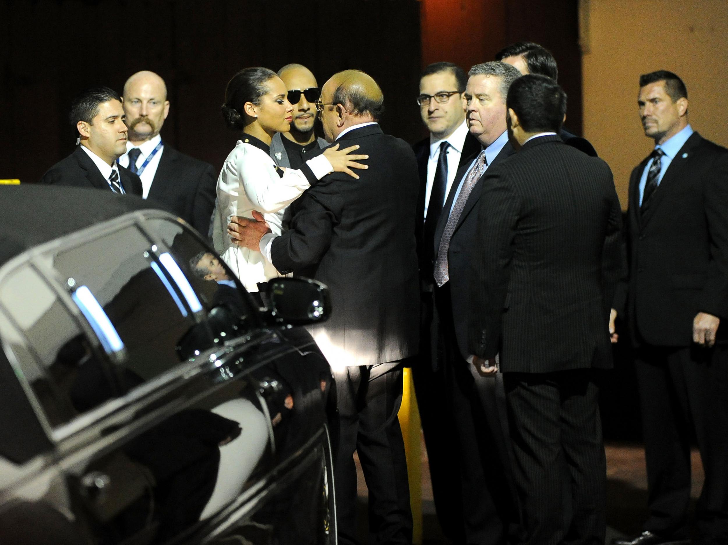 Alicia Keys, producer Swizz Beatz and Chief Creative Officer of Sony Music Entertainment, Clive Davis arrive at the Clive Davis and The Recording Academy's 2012 Pre-Grammy Gala in February 2012 (Getty)