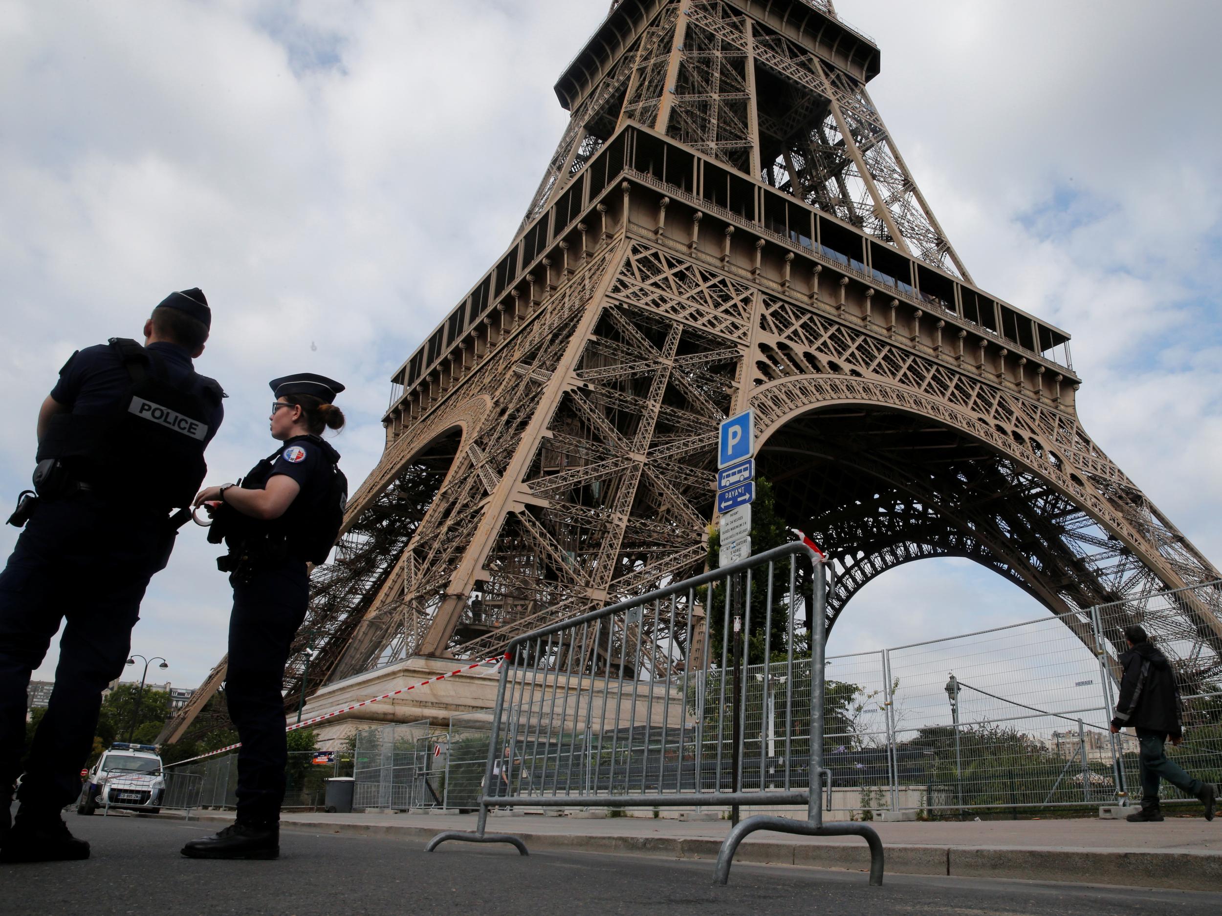 French police patrol near the Eiffel Tower as part of heightened security measures in Paris