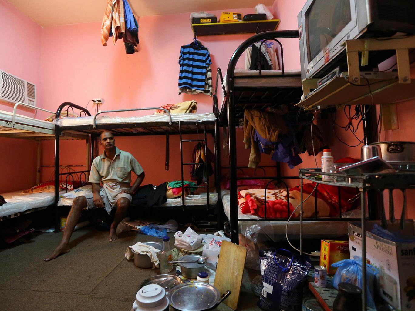 A worker contemplates his life in Qatar