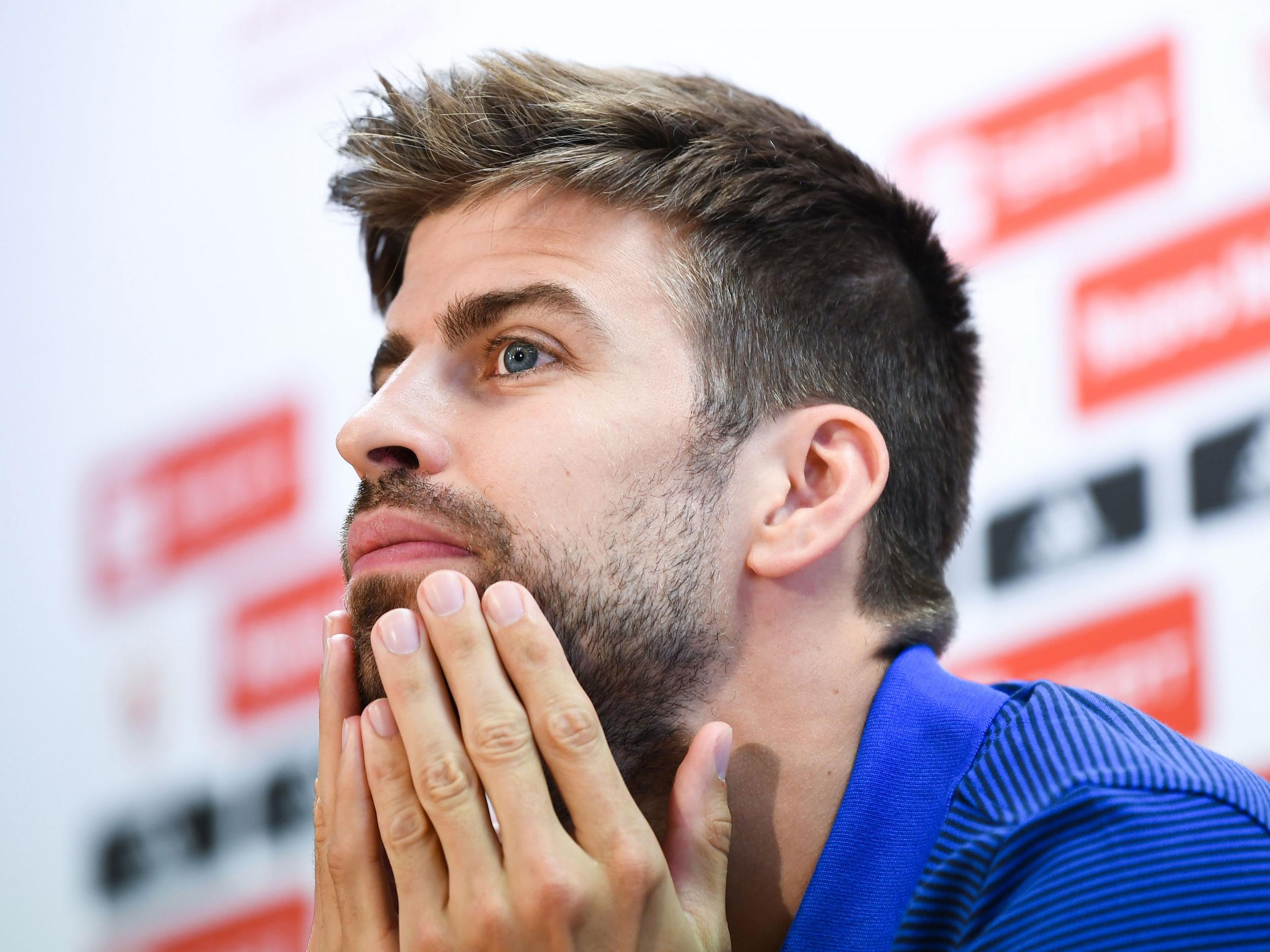 Gerard PIque speaks to the press while on Spain duty