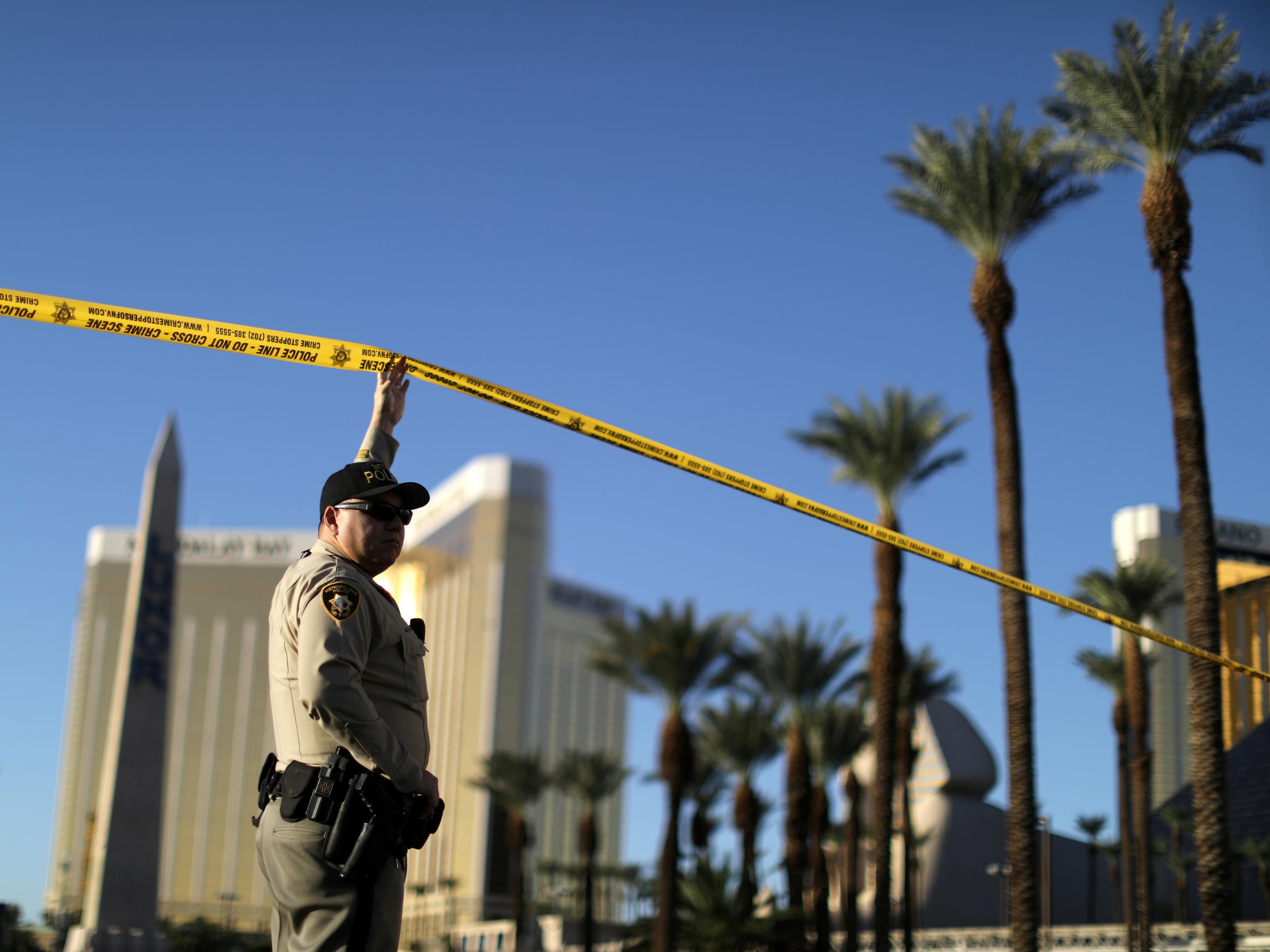 A police officer stands next to the site of the mass shooting in Las Vegas (Reuters)