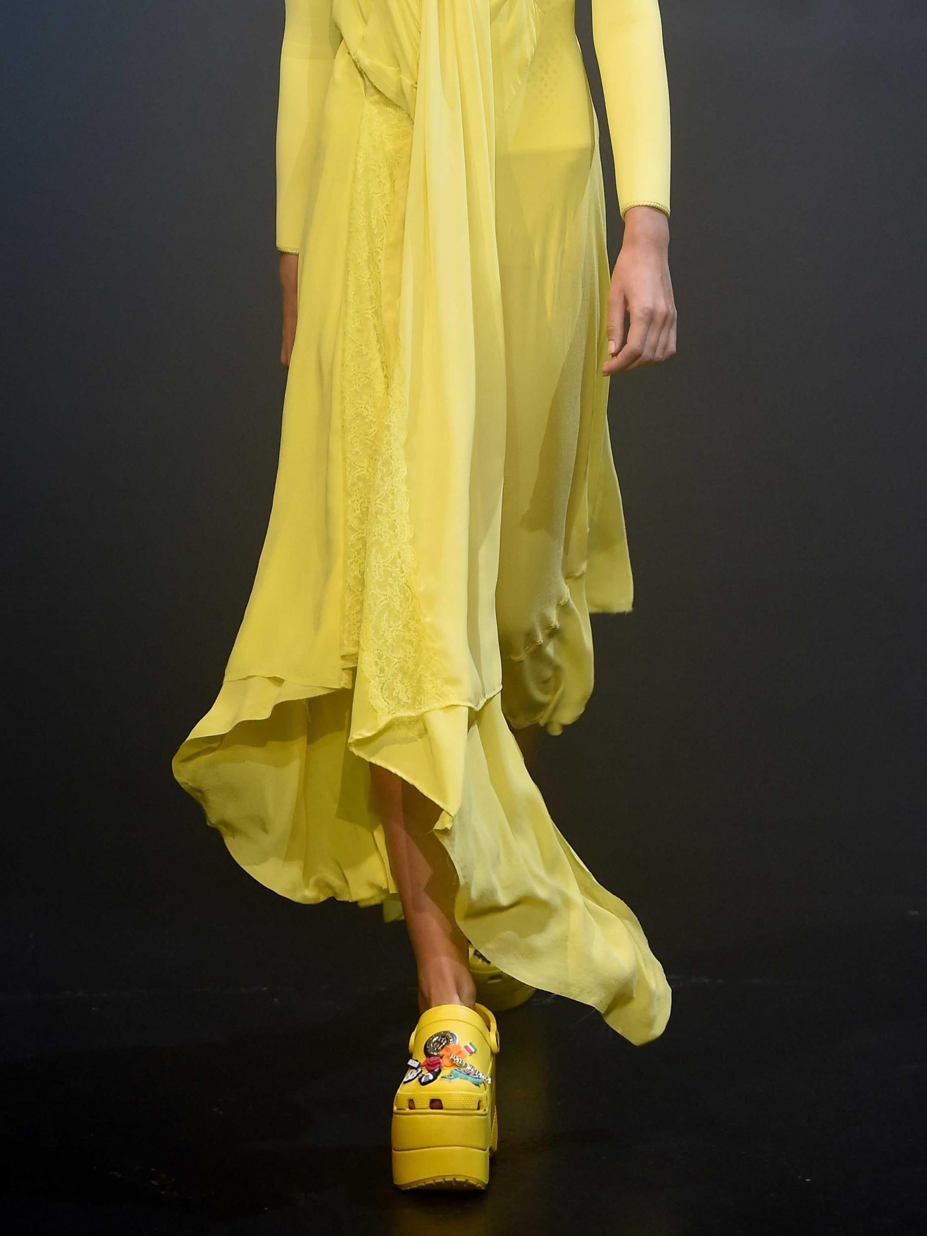 &#13;
Gvasalia's Crocs rocked school bus yellow platforms and quirky Jibbitz&#13;