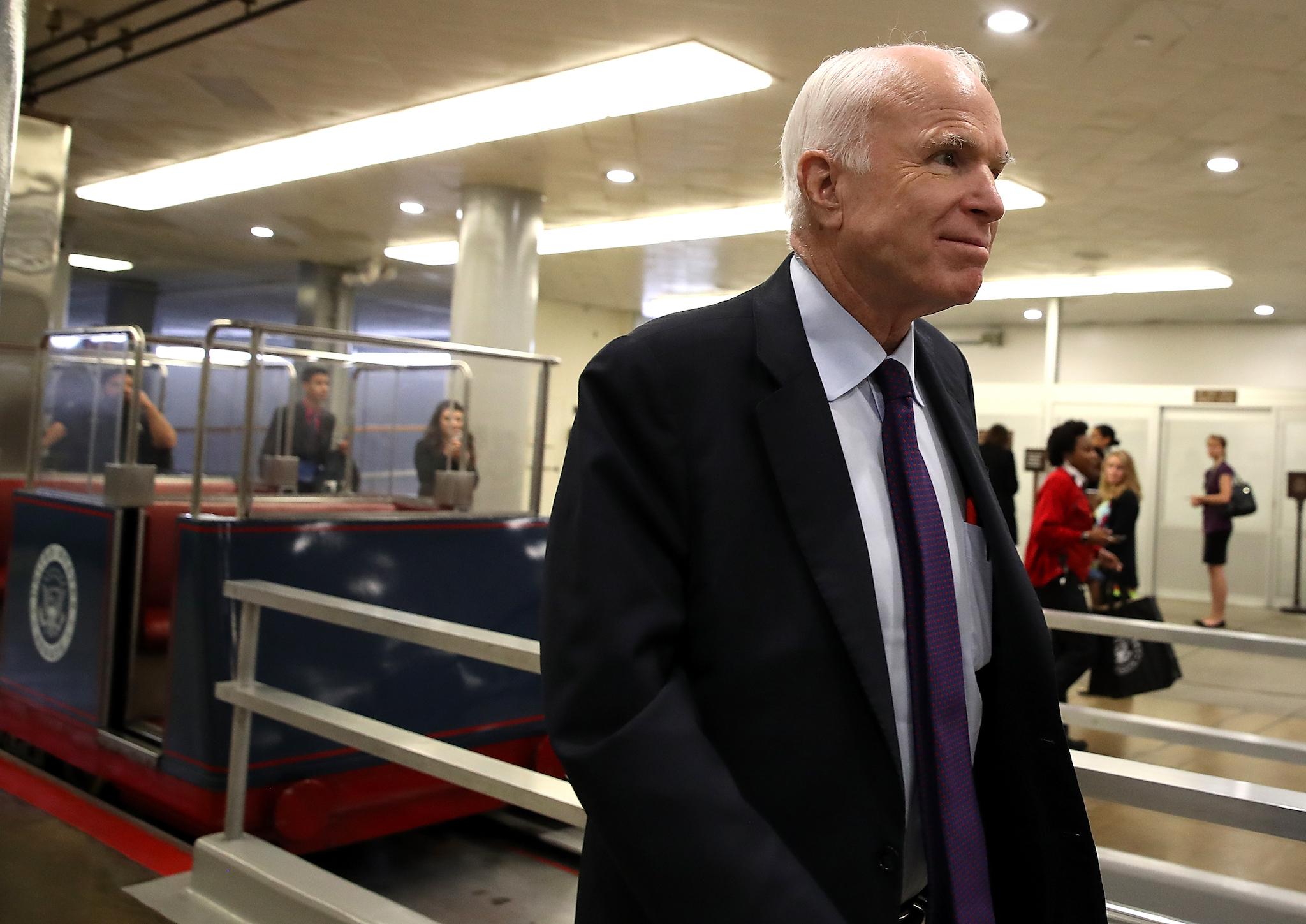 US Senator John McCain walks to the US Capitol