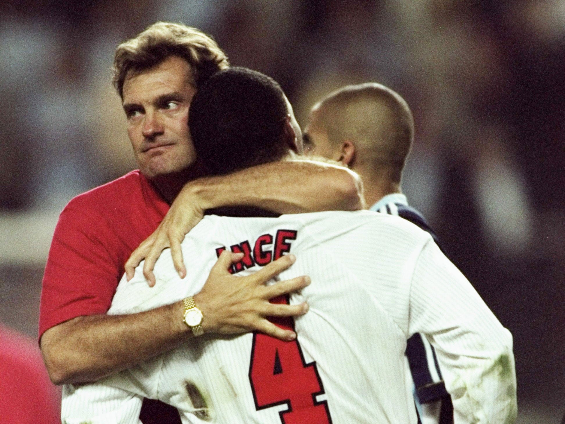 Glen Hoddle embraces Paul Ince after England's elimination from the 1998 World Cup