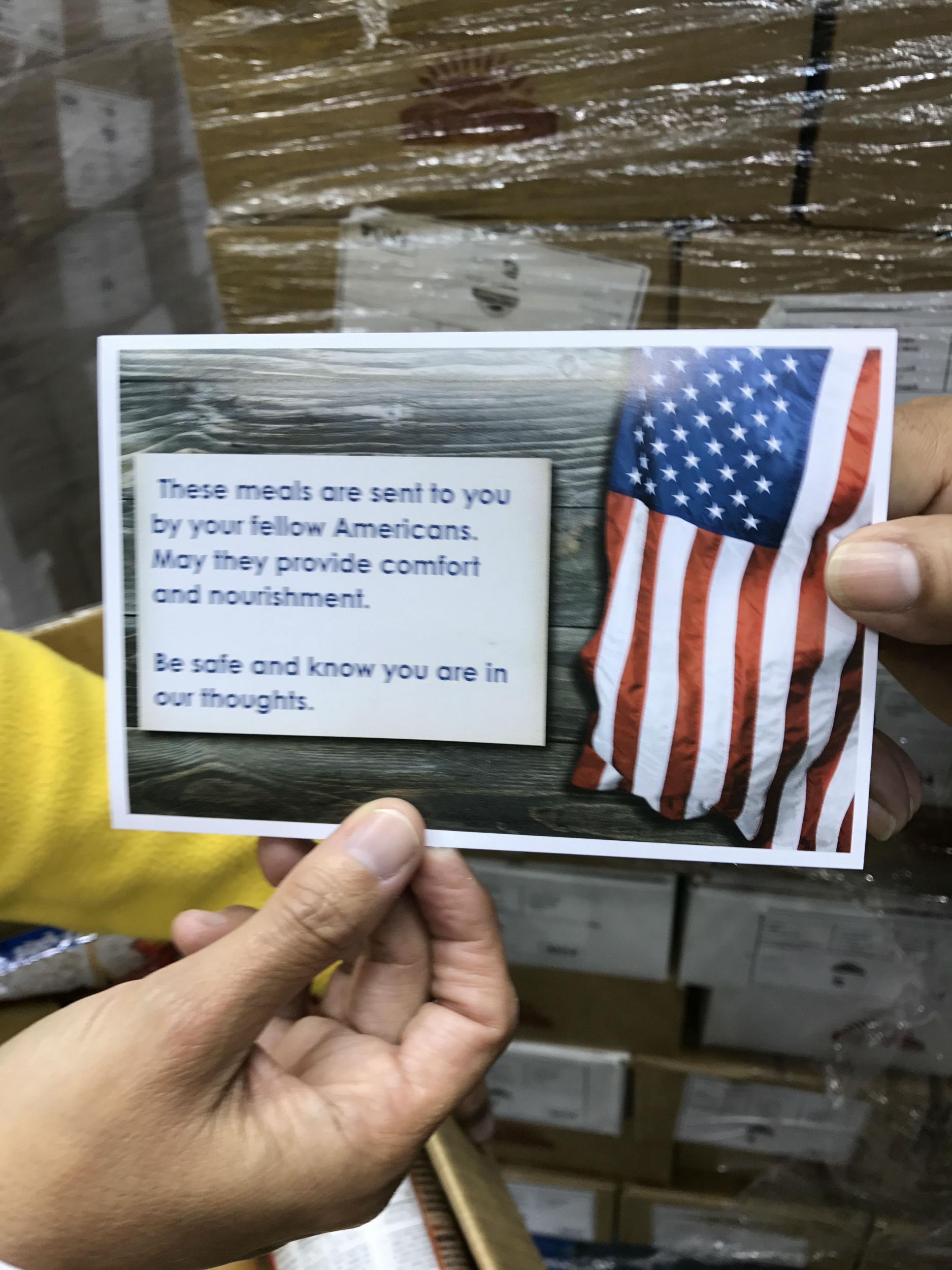 A postcard of American goodwill is included in every Fema food box along with the apple sauce and ravioli