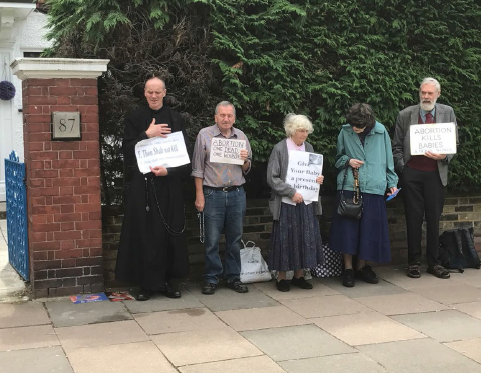 Anti-abortion demonstrators pictured standing outside the Marie Stopes clinic in Ealing