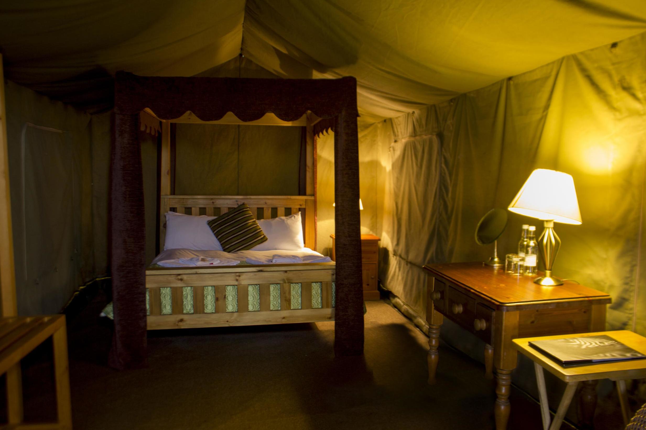 Giraffe Lodge comprises adult-only luxury tents, with en suites and a four-poster bed