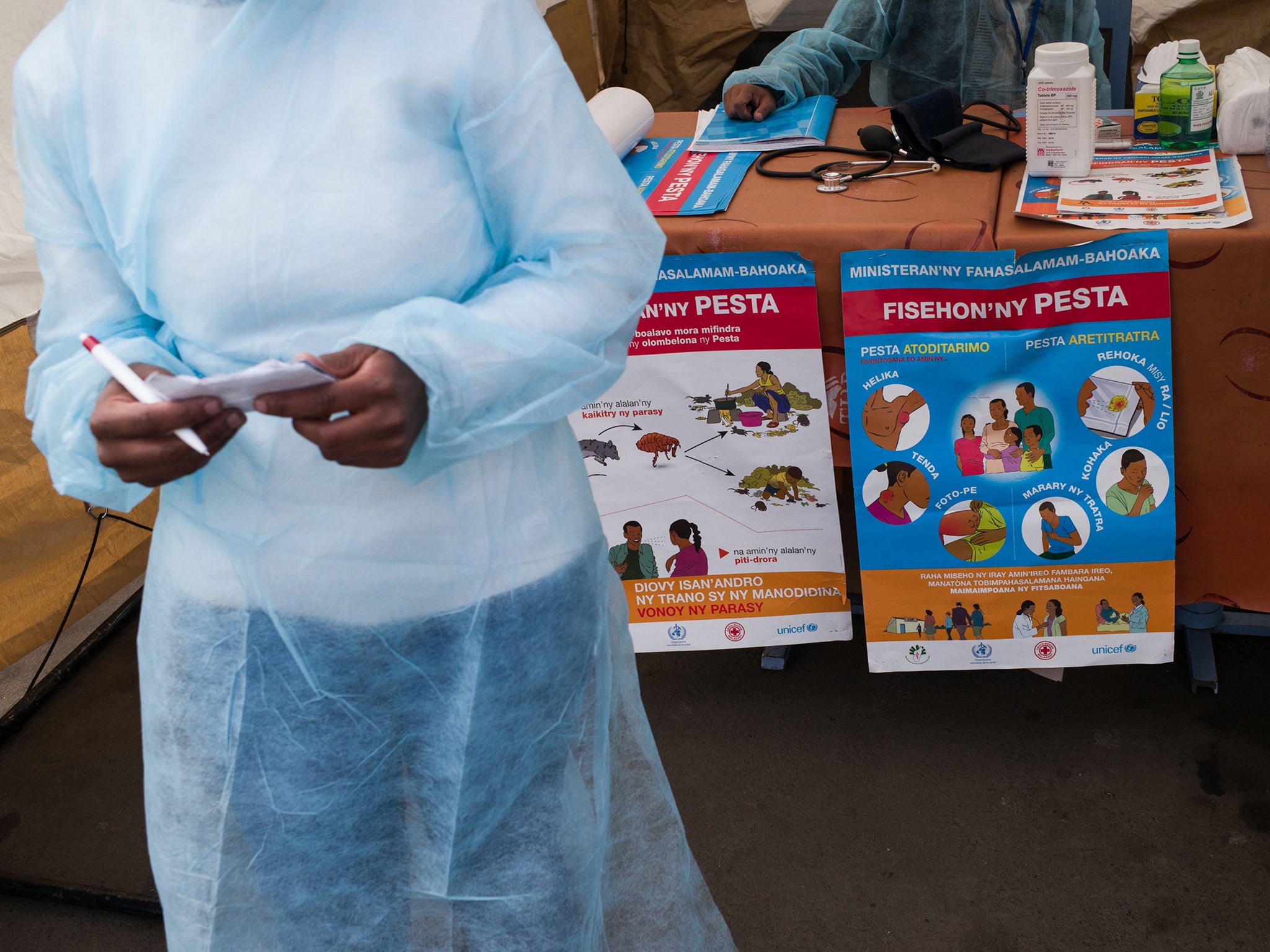 Doctors and nurses from the Ministry of Health and officers of the Malagasy Red Cross staff a healthcare checkpoint in Antananarivo