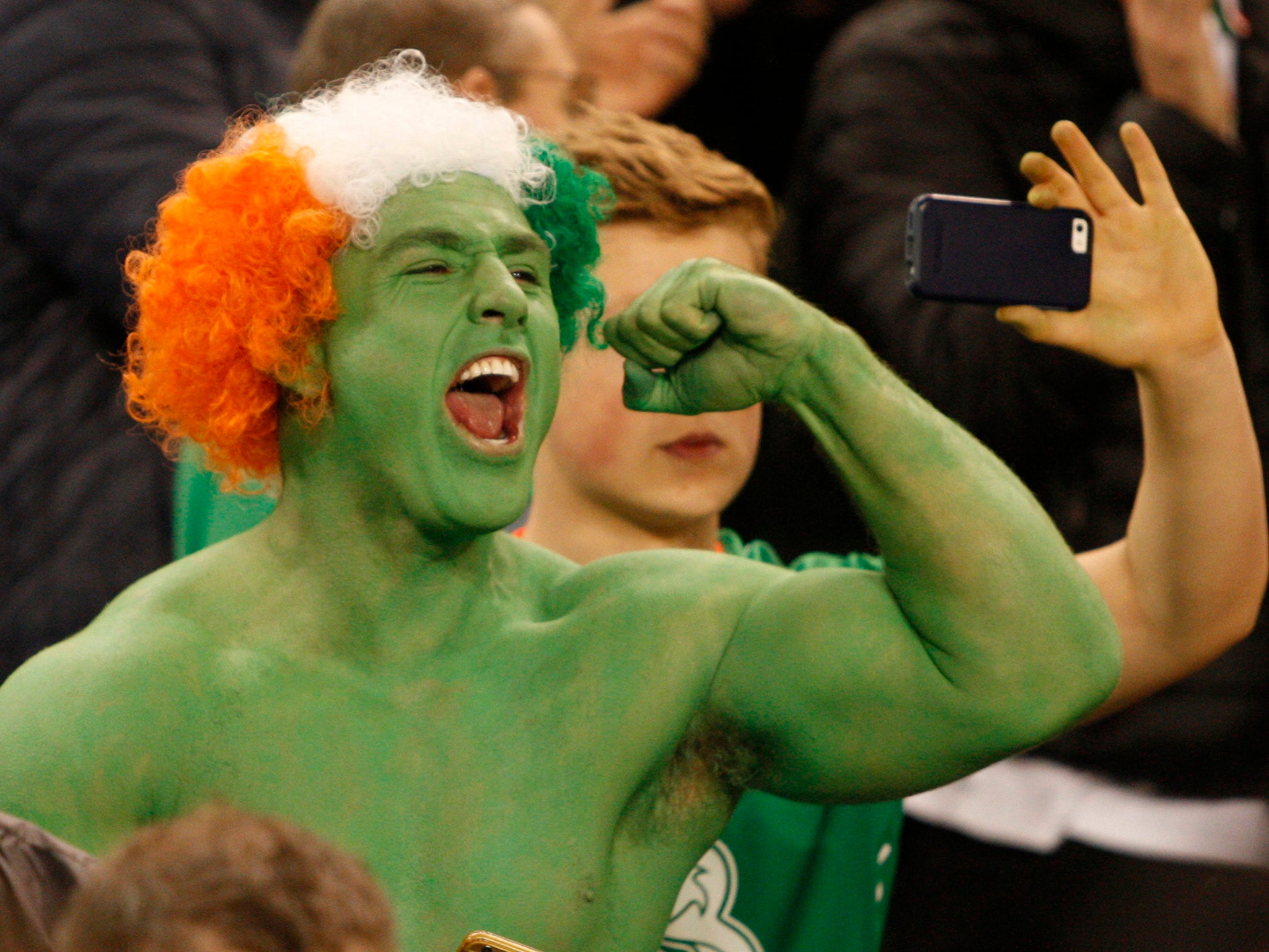 Ireland supporter 'The Green Hulk' cheers the team