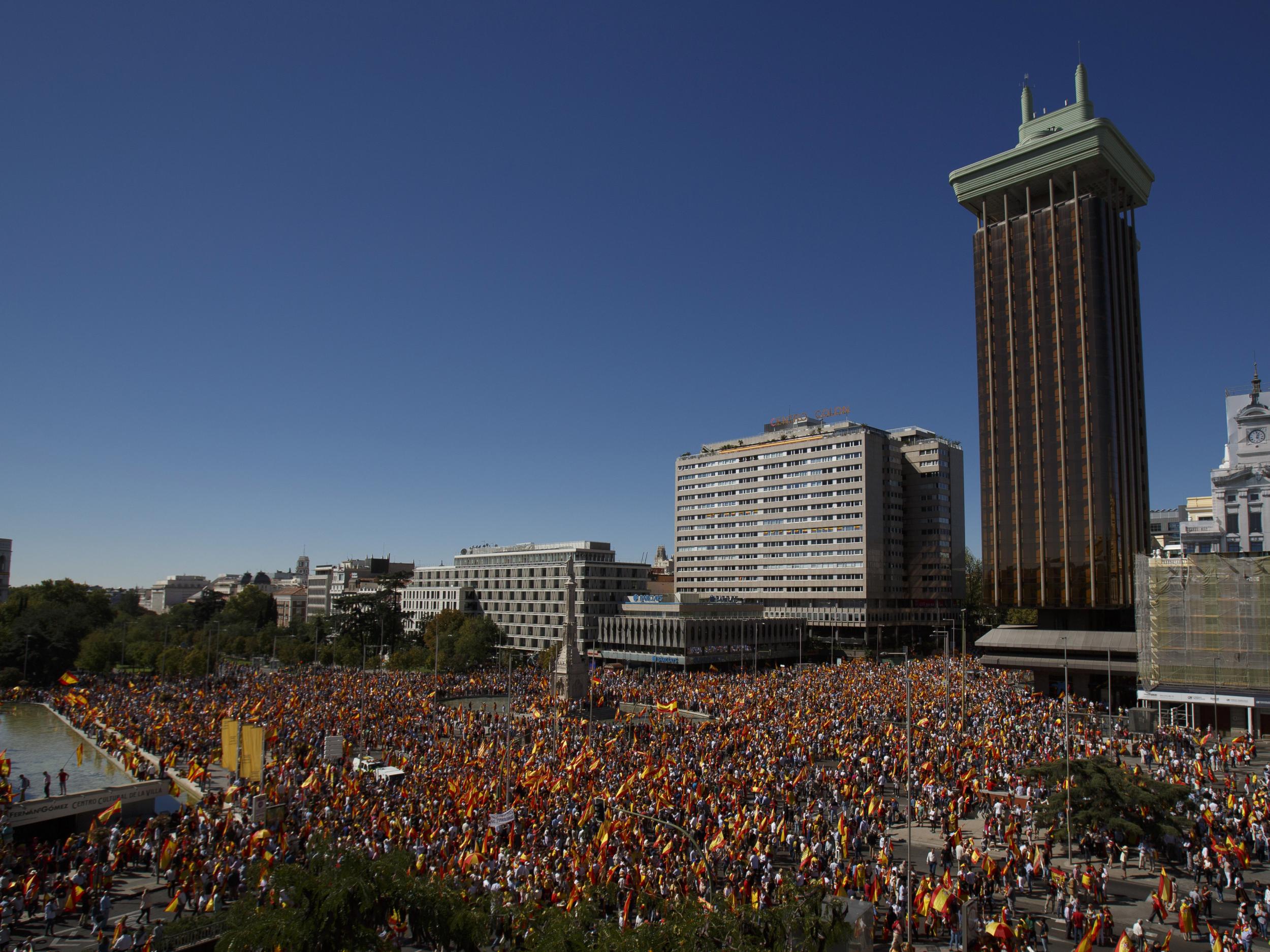 Demonstrators hold Spanish flags as they protest against the independence of Catalonia under the slogan ‘For the defense and unity of Spain’