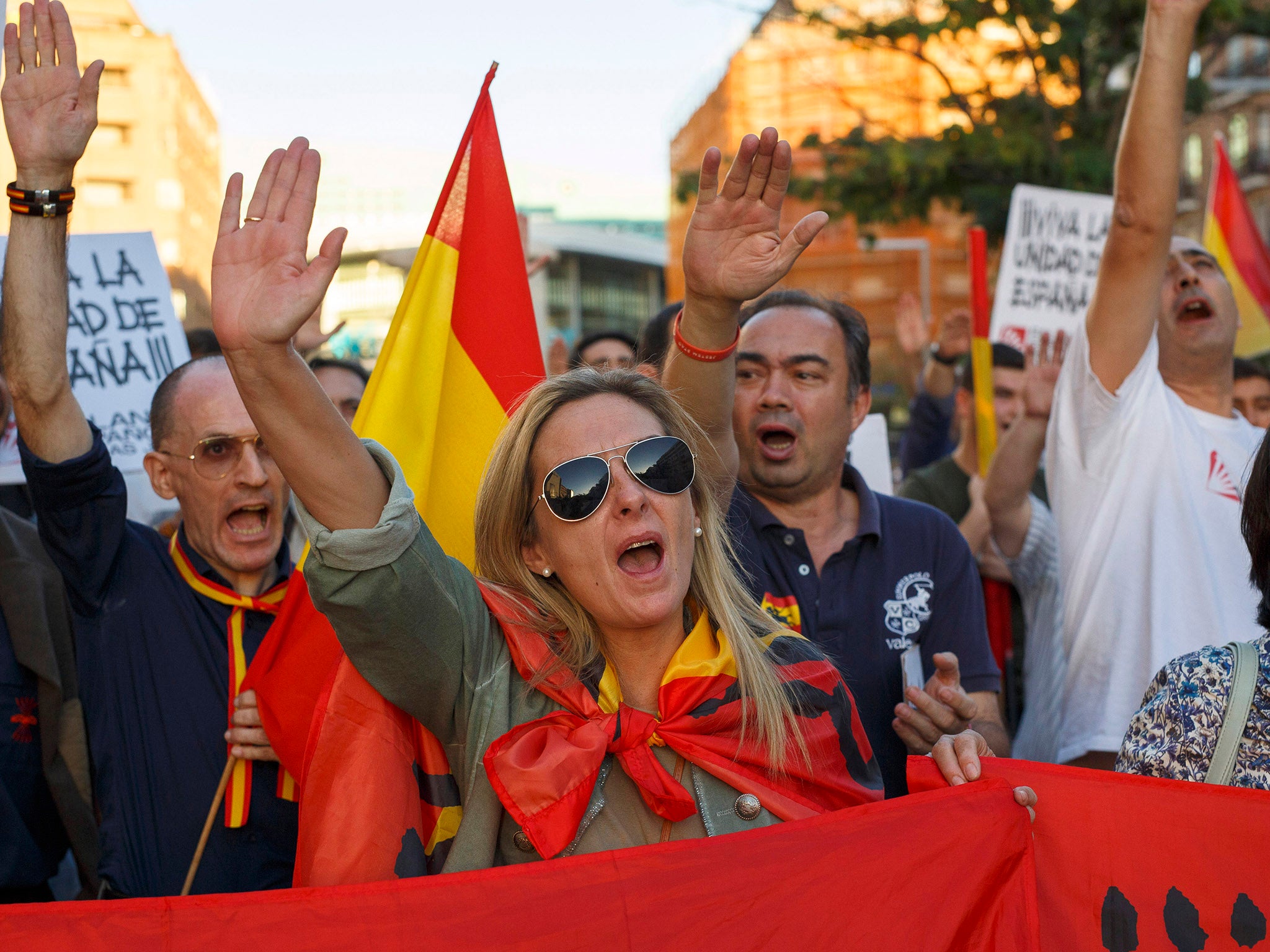 &#13;
Protesters appear to raise their arms in fascist salutes at a rally in Salvador Dali Square in Madrid &#13;