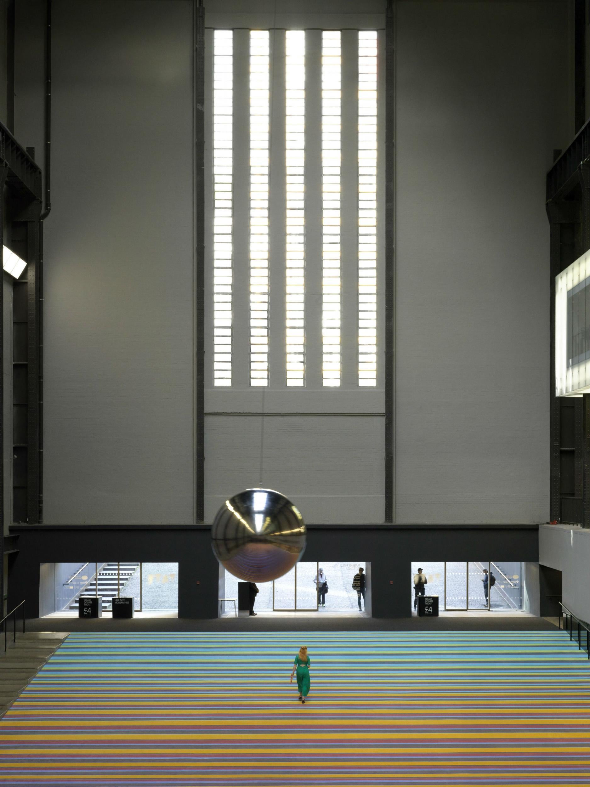 The huge stripy carpet down the long slope of the Turbine Hall complete with a silver ball that swings from side to side by Superflex