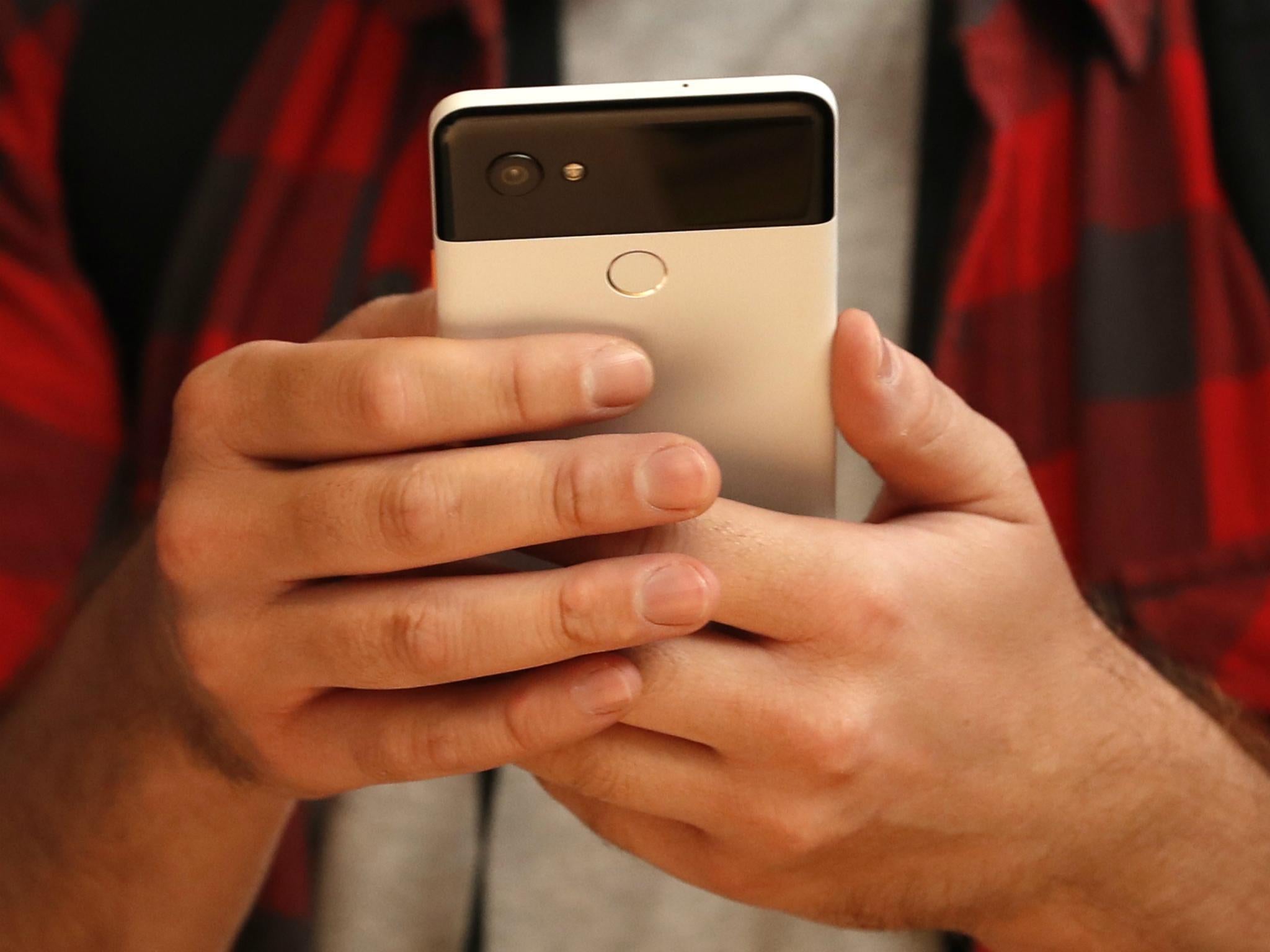 People try out Google's Pixel 2 phones during a launch event in San Francisco, California, U.S. October 4, 2017