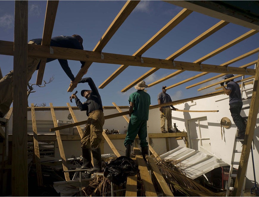 Workers repair research facilities destroyed by Hurricane Maria in Cayo Santiago.