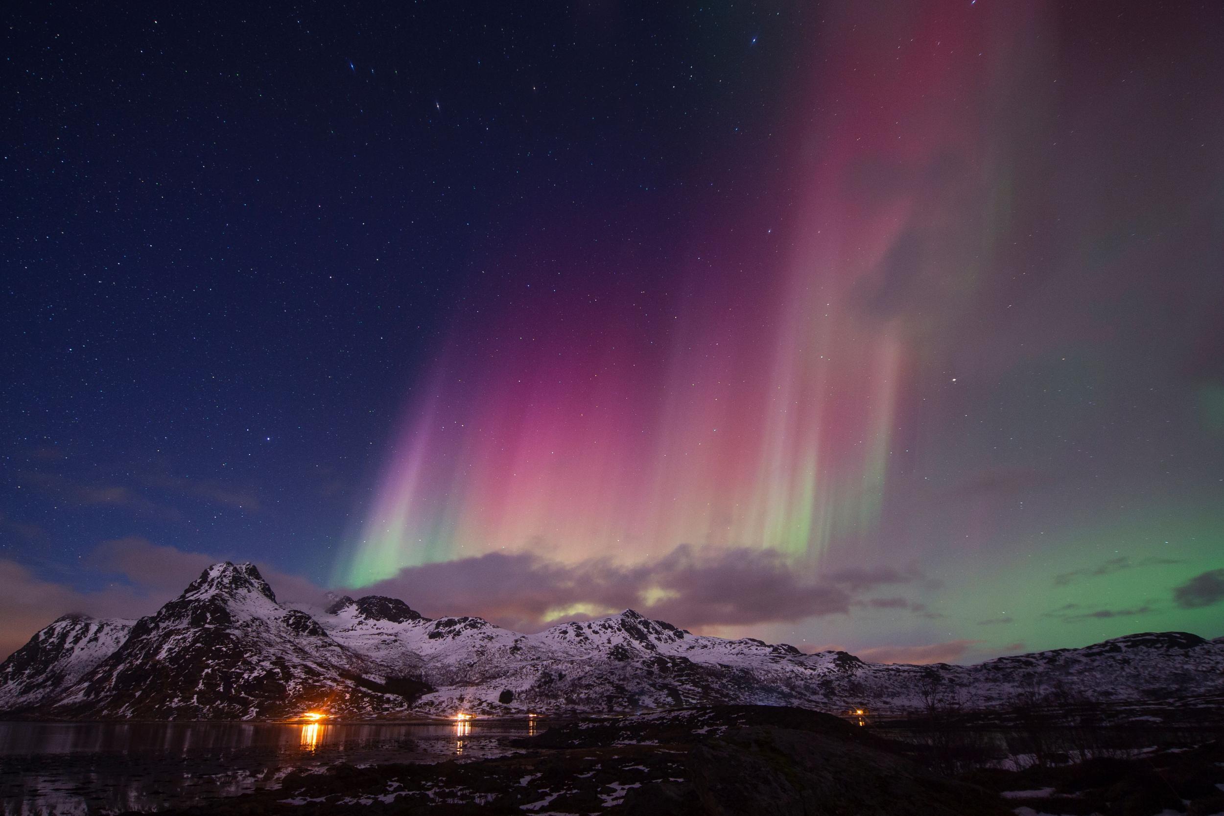 Aurora illuminates the sky above northern Norway